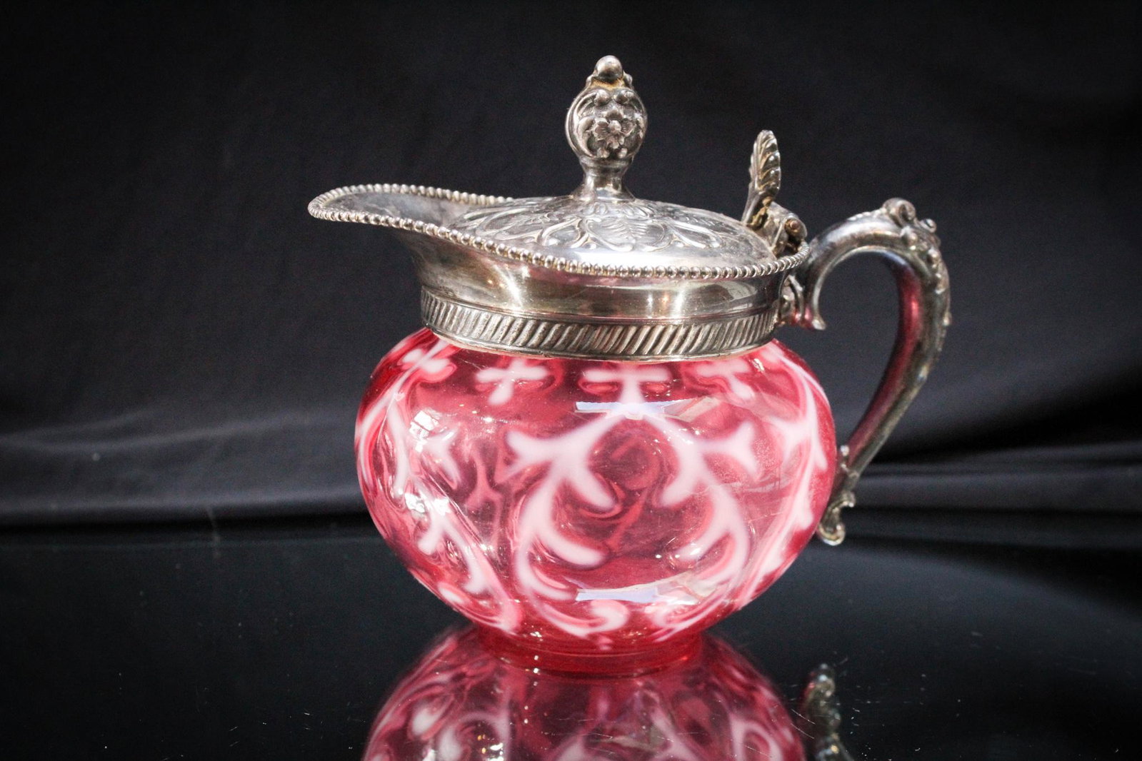 Northwood Cranberry Spanish Lace Silverplate Creamer & More: Can you believe we have another piece of cranberry Spanish Lace pattern with silverplate? Yep we do. And this lot has the addition of some extra silverplate hardware. Measures 5" tall.
