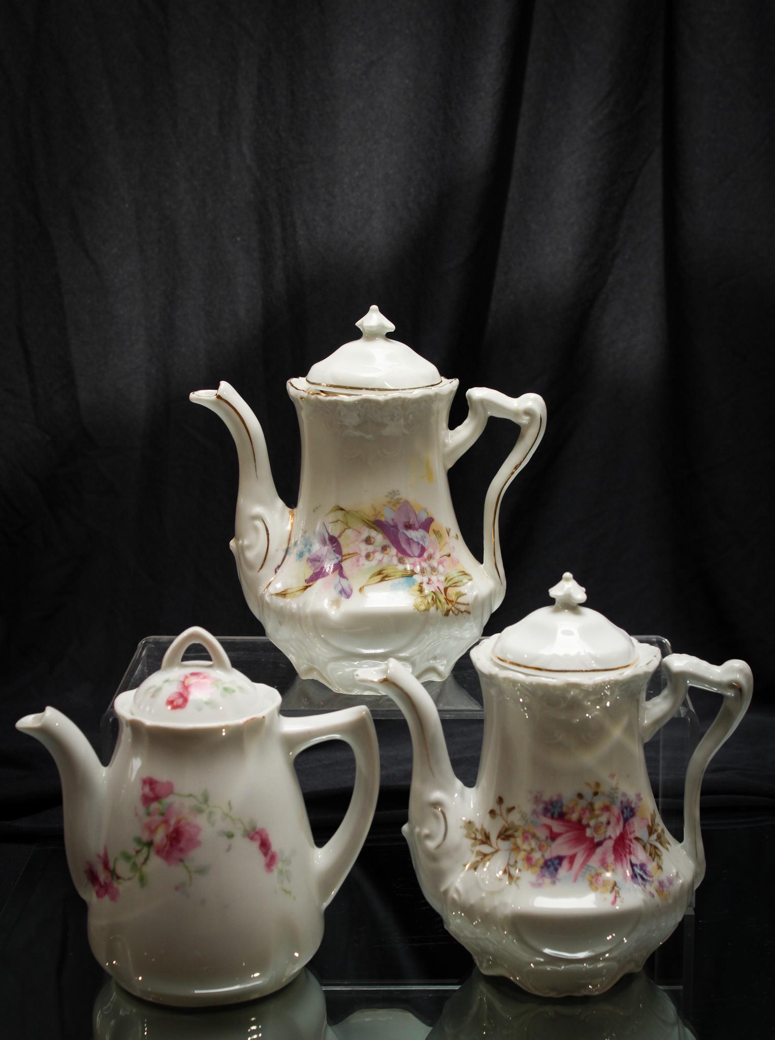 Victorian 3 pc Lot Floral DÃ©cor Child's Tea Pots: For those of you that like flowers, we have this exquisite offering of three floral dÃ©cor child's tea pots. Tallest measures 6" high.