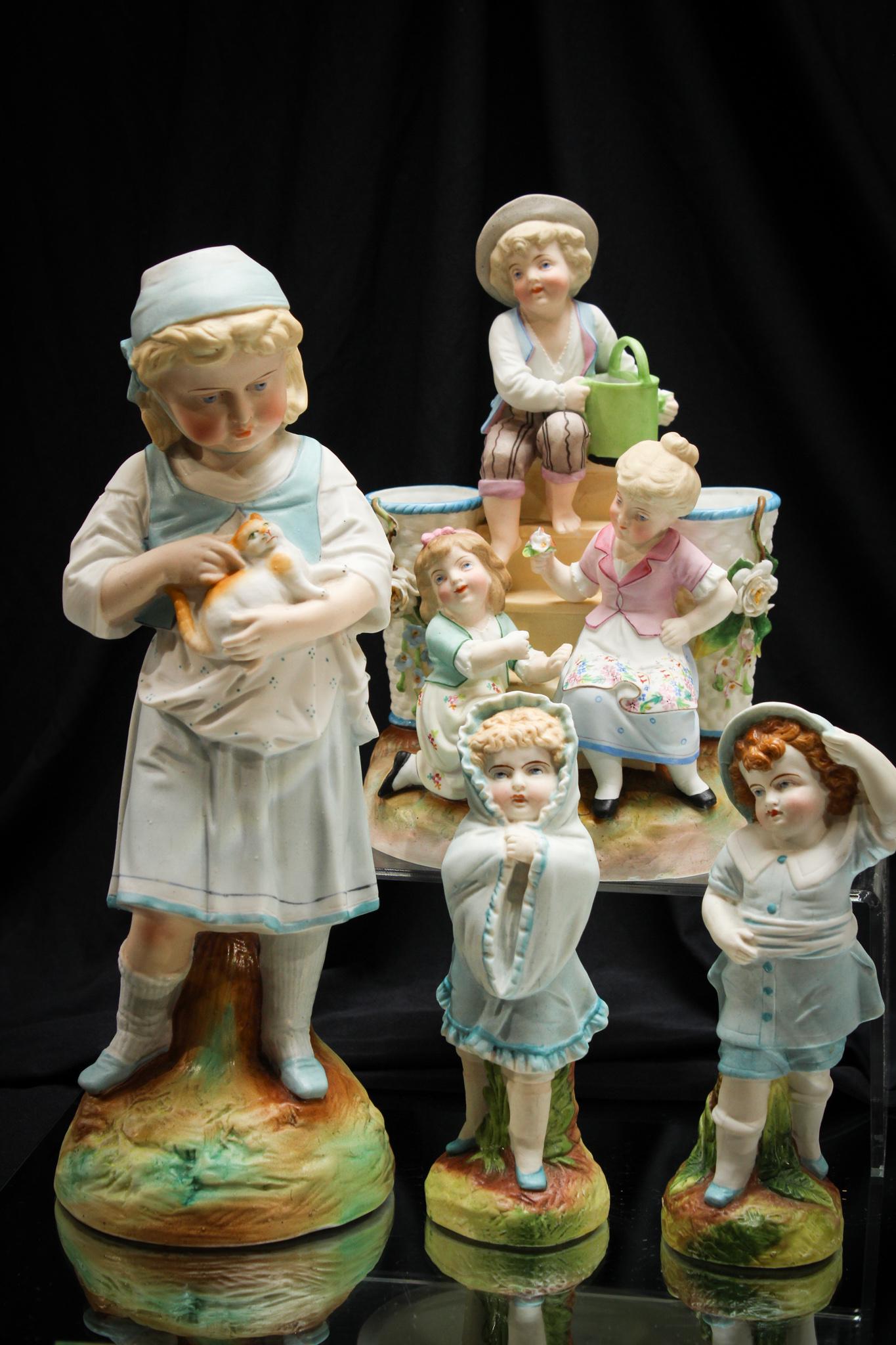 Lot of 4 pcs Victorian Bisque Porcelain Statuary: Charming grouping of 4 pieces of Victorian bisque statuary at it's best. Great detail and forms. Tallest measures 12" high.