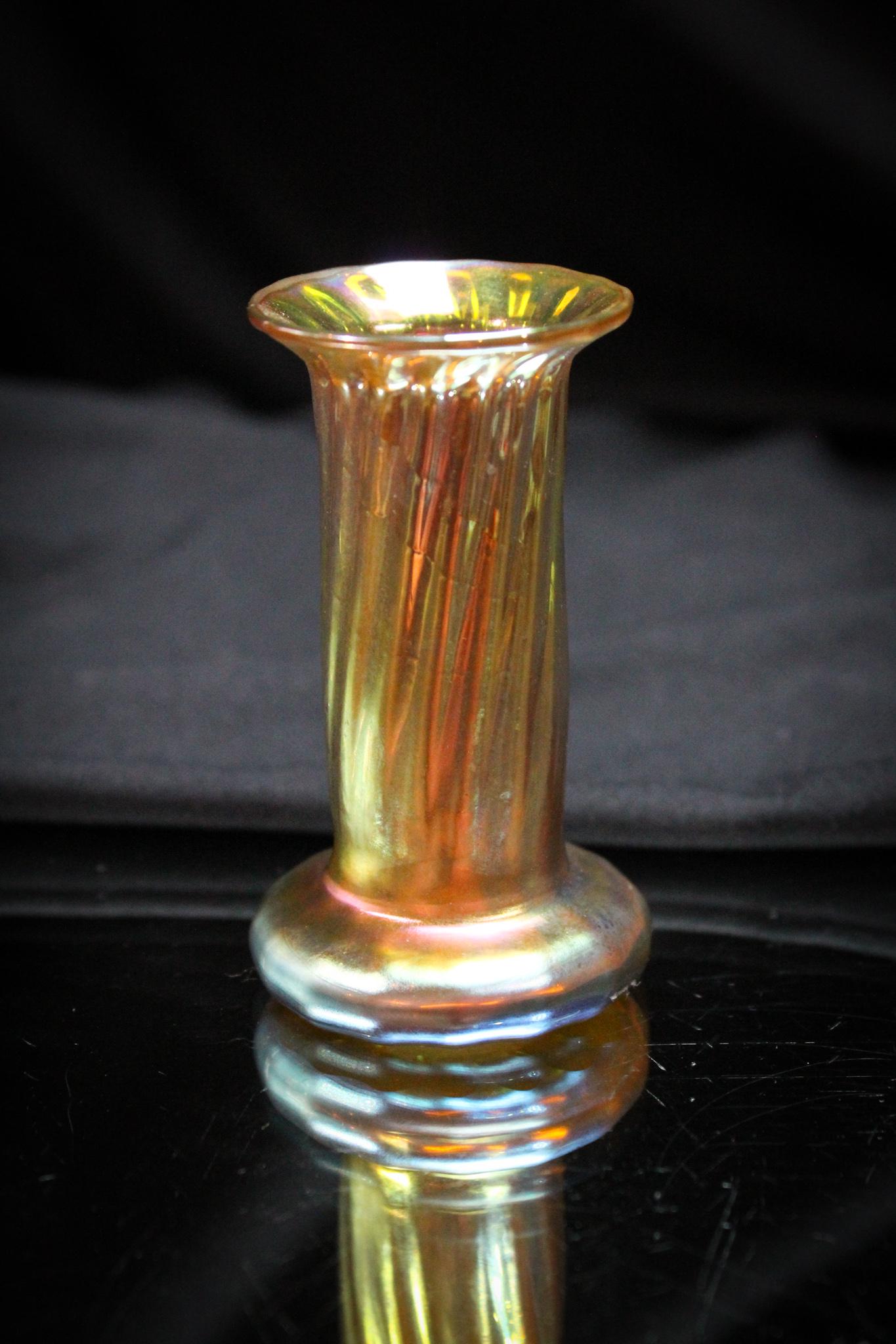 Contemporary Gold Aurene Irridescent 2 3/4" Cabinet Vase: Sweet little Contemporary gold aurene irridescent cabinet vase. Vase has ribbed exterior. A spurious "Tiffany" mark on the base. Measures 2 3/4" tall.