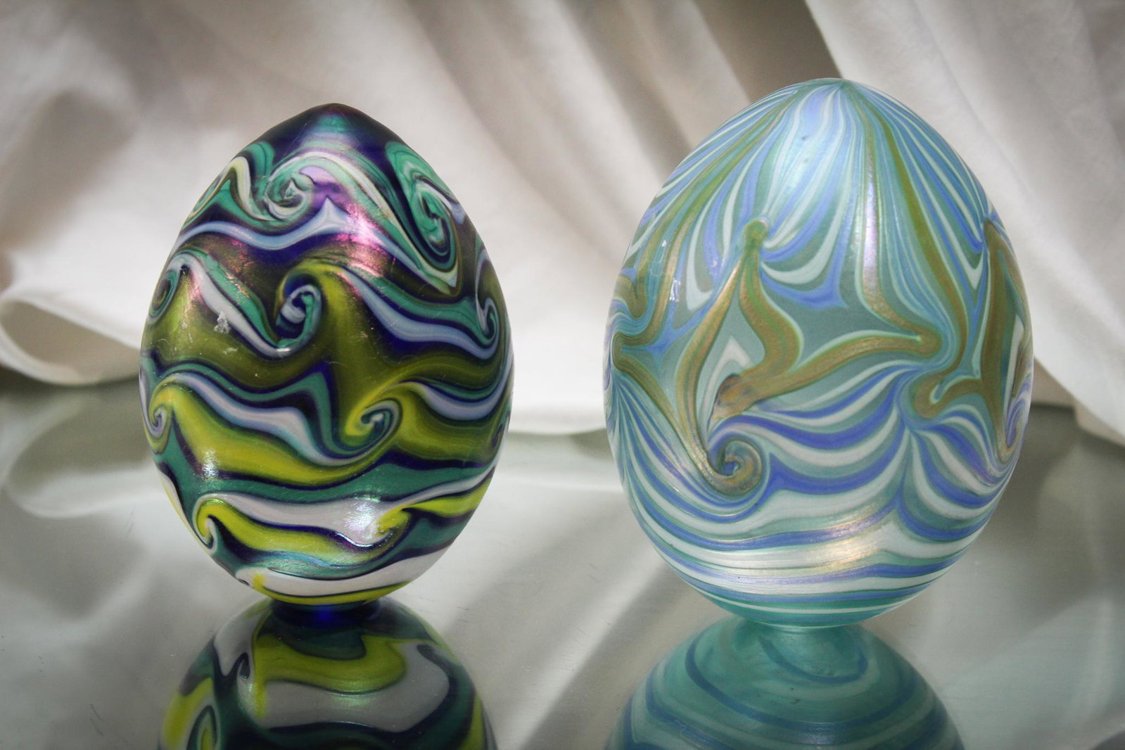 Lot of 2 Vandermark Art Glass Eggs: Nice pair of Vandermark art glass eggs. One is dated 1976. The other is dated 1978. Tallest measures 5" high.