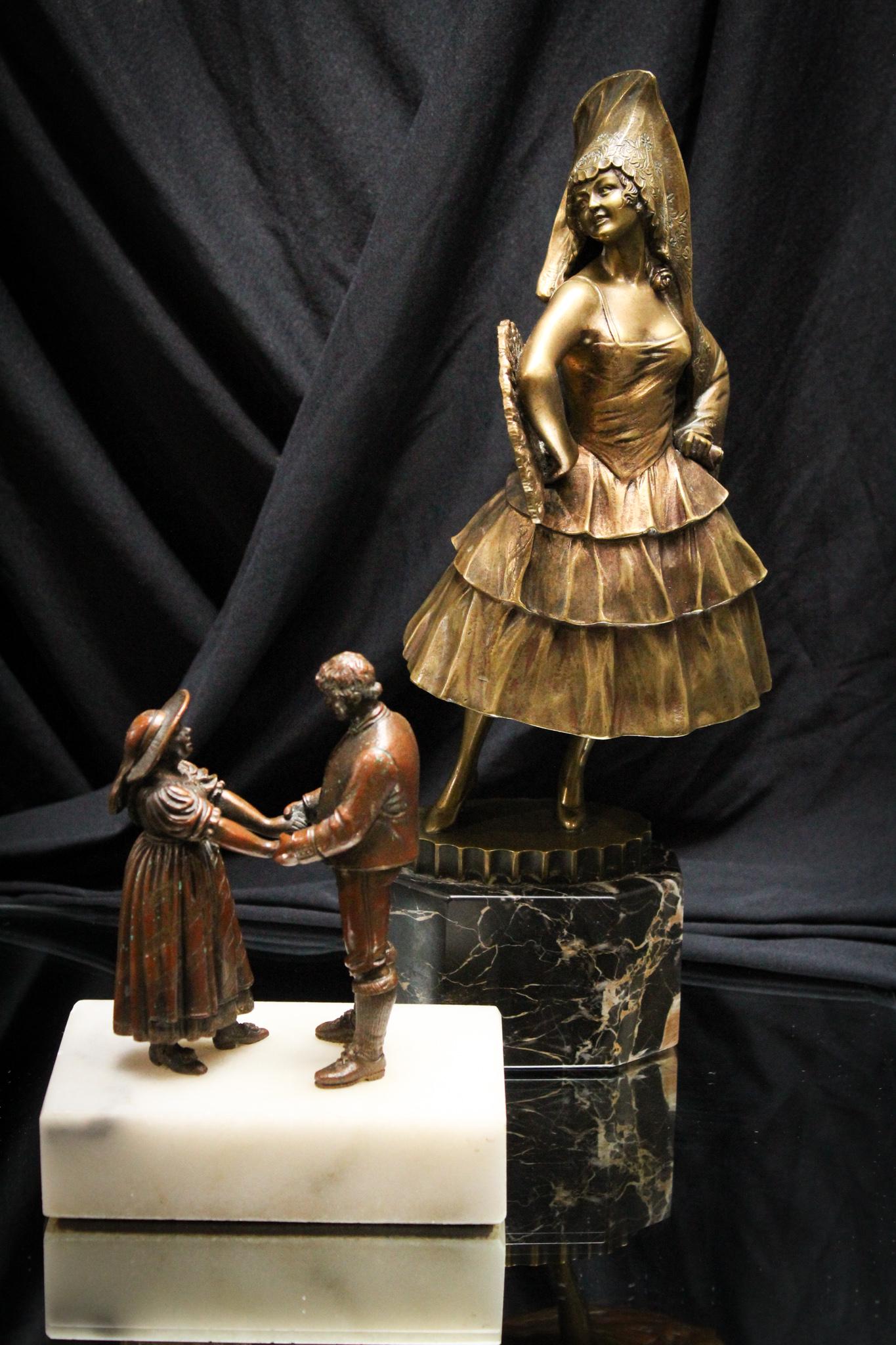 2 pc Lot Antique Bronze Figures on Marble: Wonderful offering here folks of two bronze figures on marble plinths. Spanish dancer on black marble is signed "Titze". Courting couple on white marble is unsigned. Tallest measures 12".