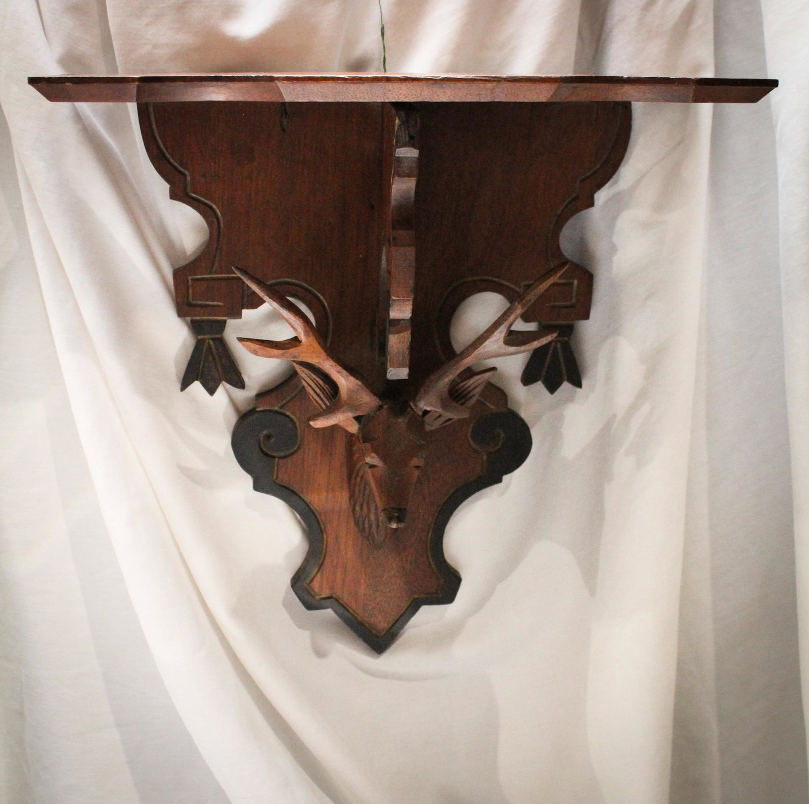Victorian Black Forest Walnut Carved Stag Shelf: What a great piece of Victoriana Black Forest walnut this shelf is. Complete with gilt and ebonized dÃ©cor and full figure stag head. Measures 12" by 12".