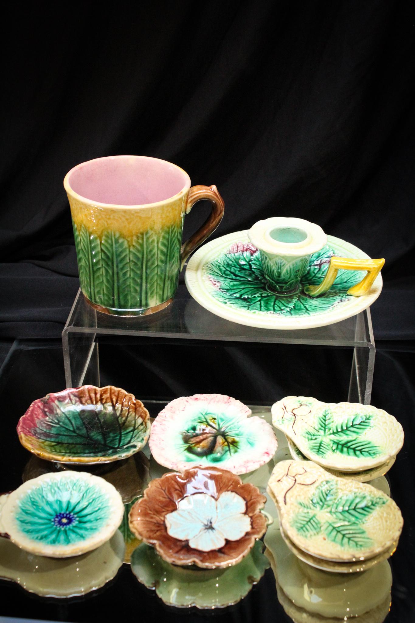 10 pc Lot Victorian English Majolica Butter Pats & More: Mega Magnum Auctions lot of 10 piece of Victorian Englsih majolica pottery comprised of 8 butter pats, candlestick, and a cup.