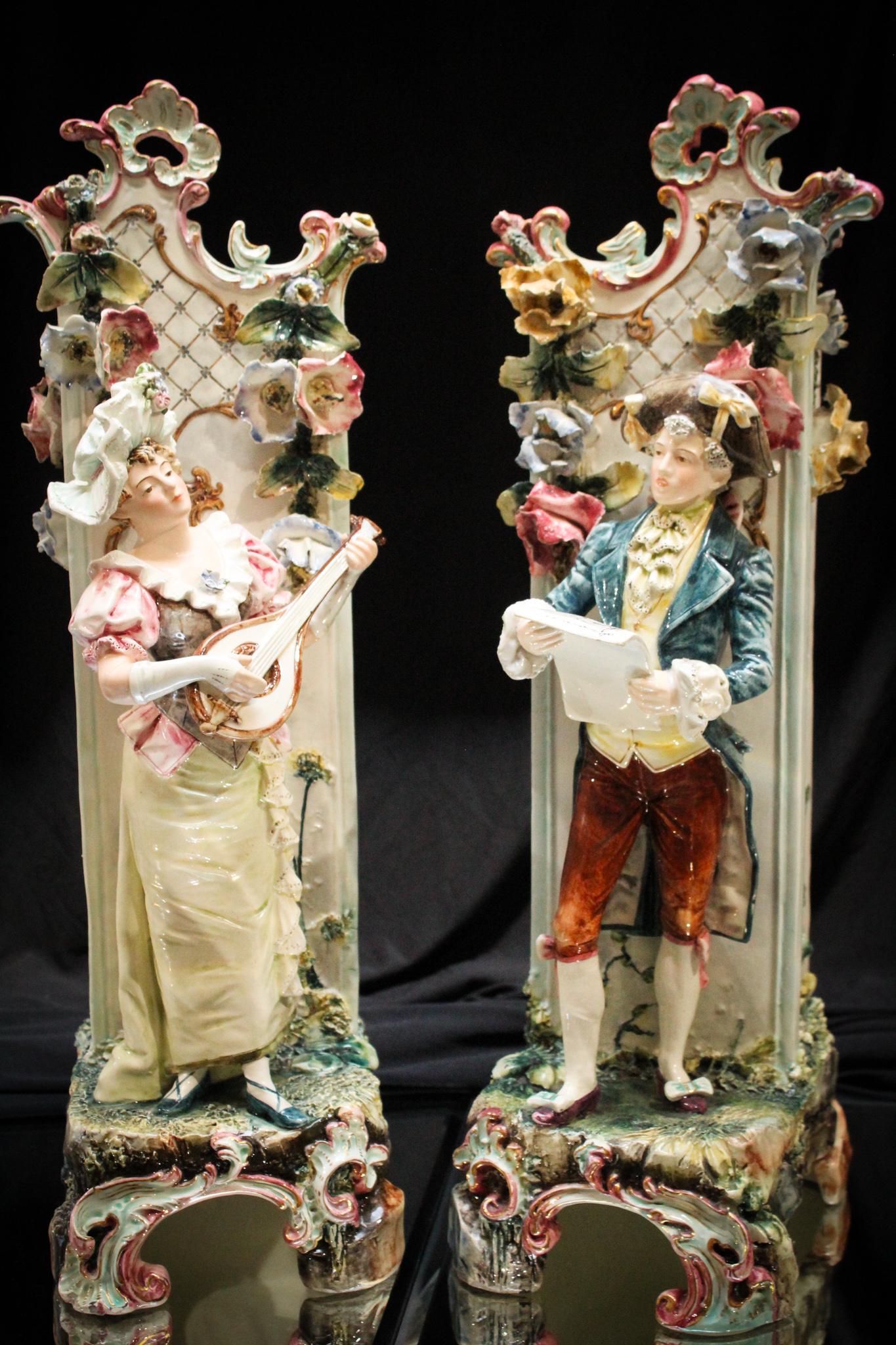 Pr. 18" Victorian English Majolica Musical Figural Vases: Pair of Victorian English majolica pottery musical figures. The lady is playing an instrument and the man is reading sheet music. Very detailed and lovely. Largest measures 18" tall.