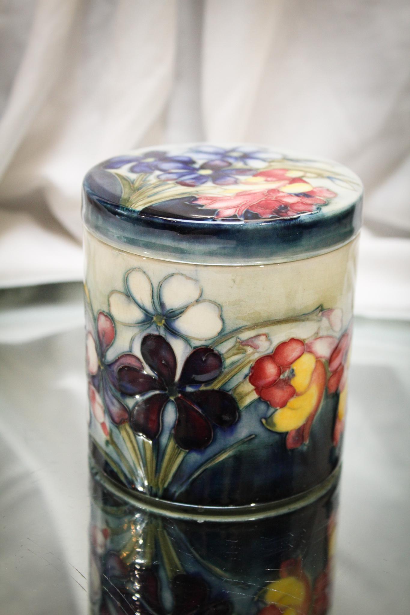 Moorcroft Pottery Floral Covered Jar: Sweet Moorcroft pottery covered jar in floral motif dÃ©cor. Nice find here folks! Measures 4" tall.