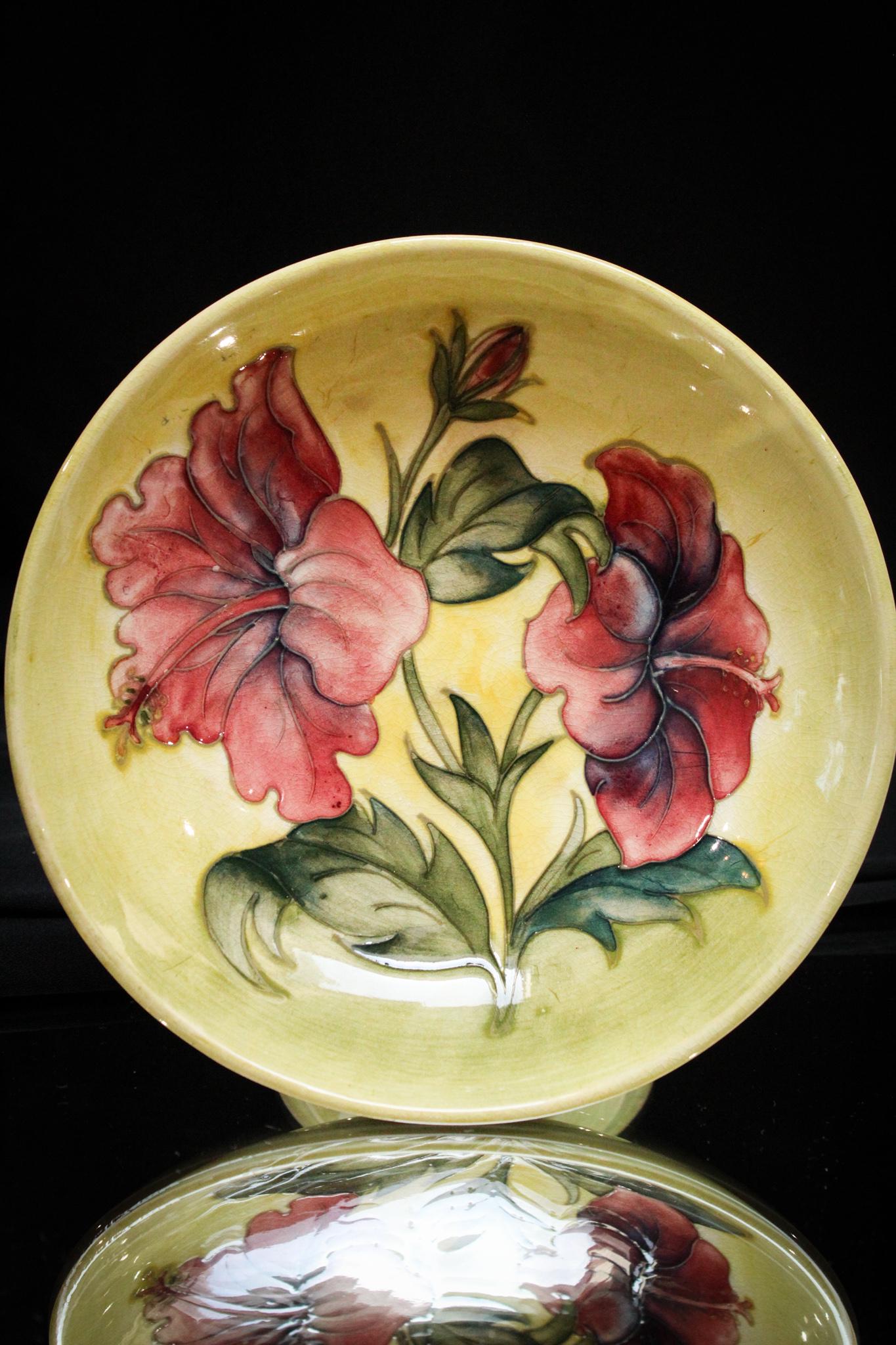 Moorcroft Pottery Hibiscus DÃ©cor Compote: What a nice piece this one is folks! A Moorcroft pottery compote with hibiscus flower dÃ©cor. So pretty. Measures 4" by 7 1/2".