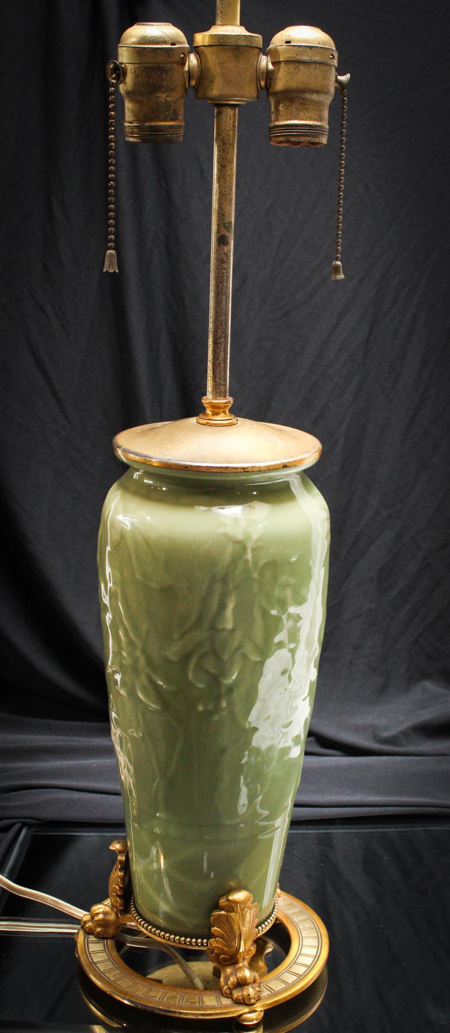 Rookwood Olive Green Fuscia DÃ©cor Lamp: Killer Rookwood table lamp with original mountings and hardware. Pottery is in a subtle olive grey green. Embossed fuscia flower dÃ©cor. Such a great piece! Just add your choice of shade. Measures 2