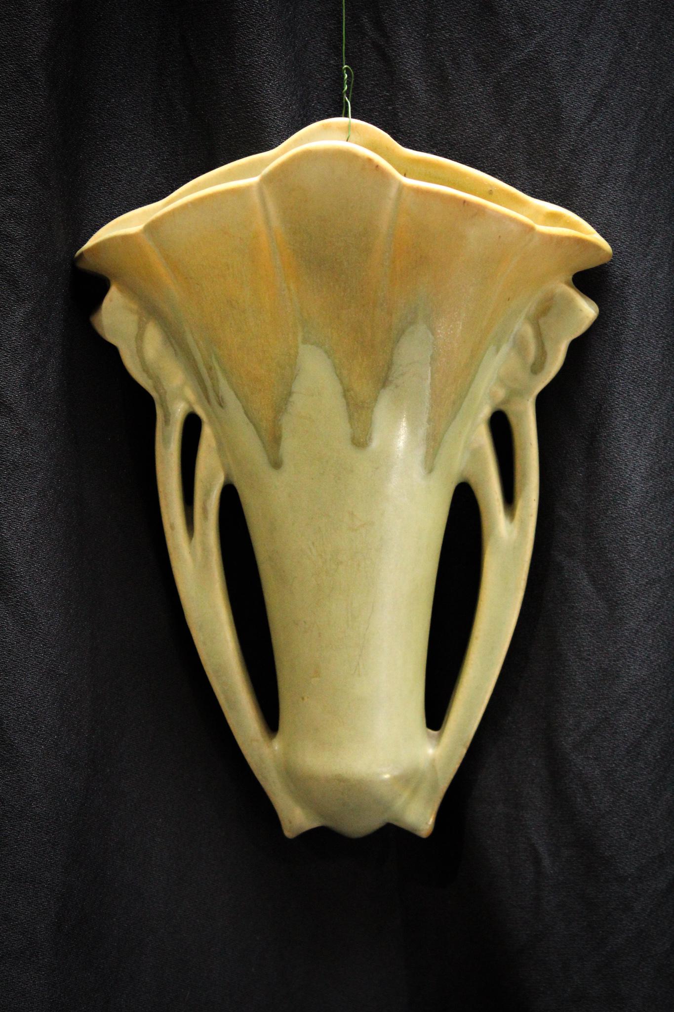 Roseville Pottery Carnelian Wall Pocket: Do your walls have pockets? If not, have you ever wondered why? Well, first off, if you don't have them it means you've never bought one. Now is your chance to add one to your bare wall with this love
