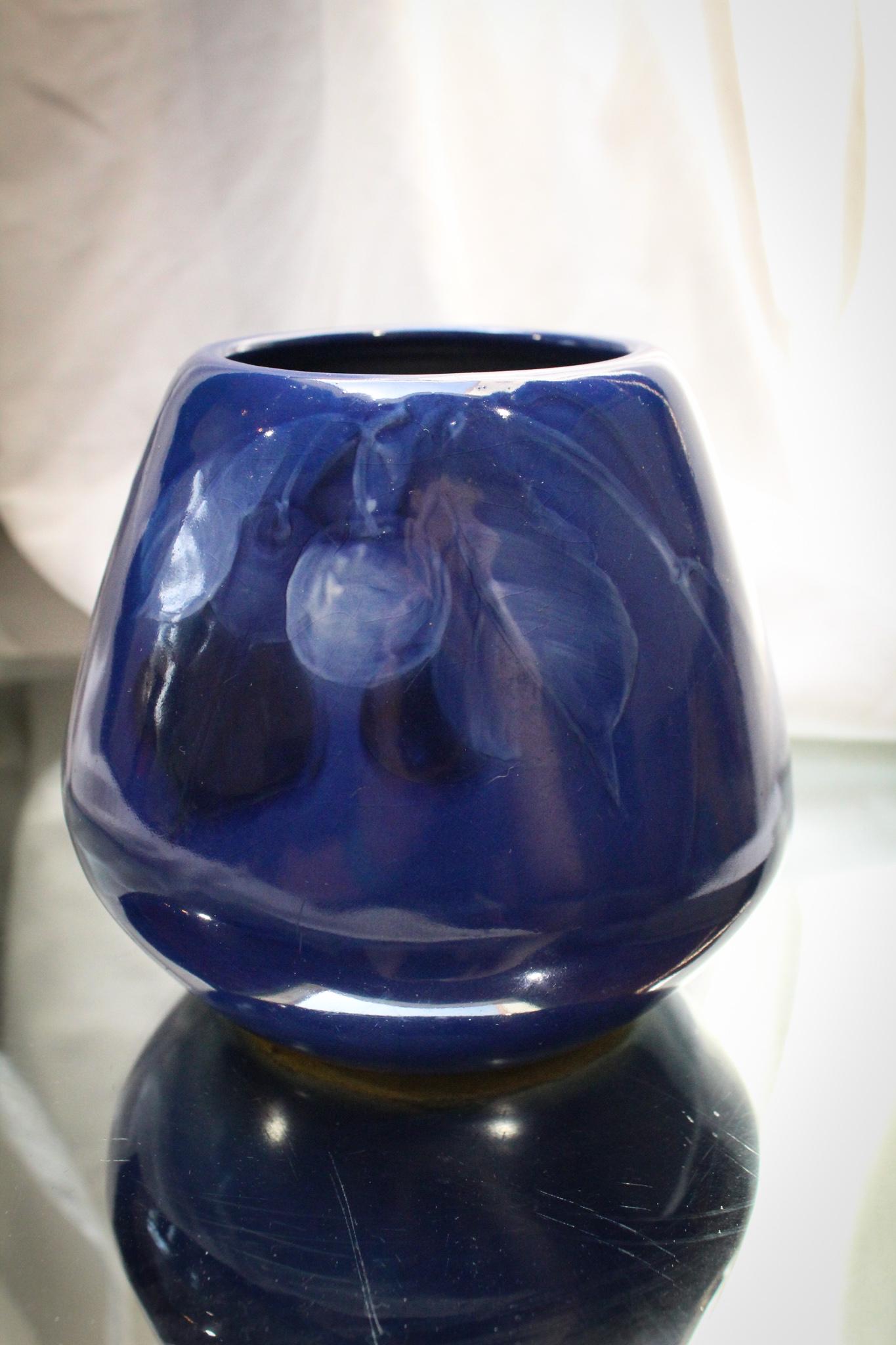 Weller Pottery Louwelsa Blue Cherry Vase: Nothing more prized than blue cherries and this example of Weller pottery is just that. A prized example of Weller pottery in the Louwelsa line. Scrumptious dÃ©cor in blue of the ever popular fruit.