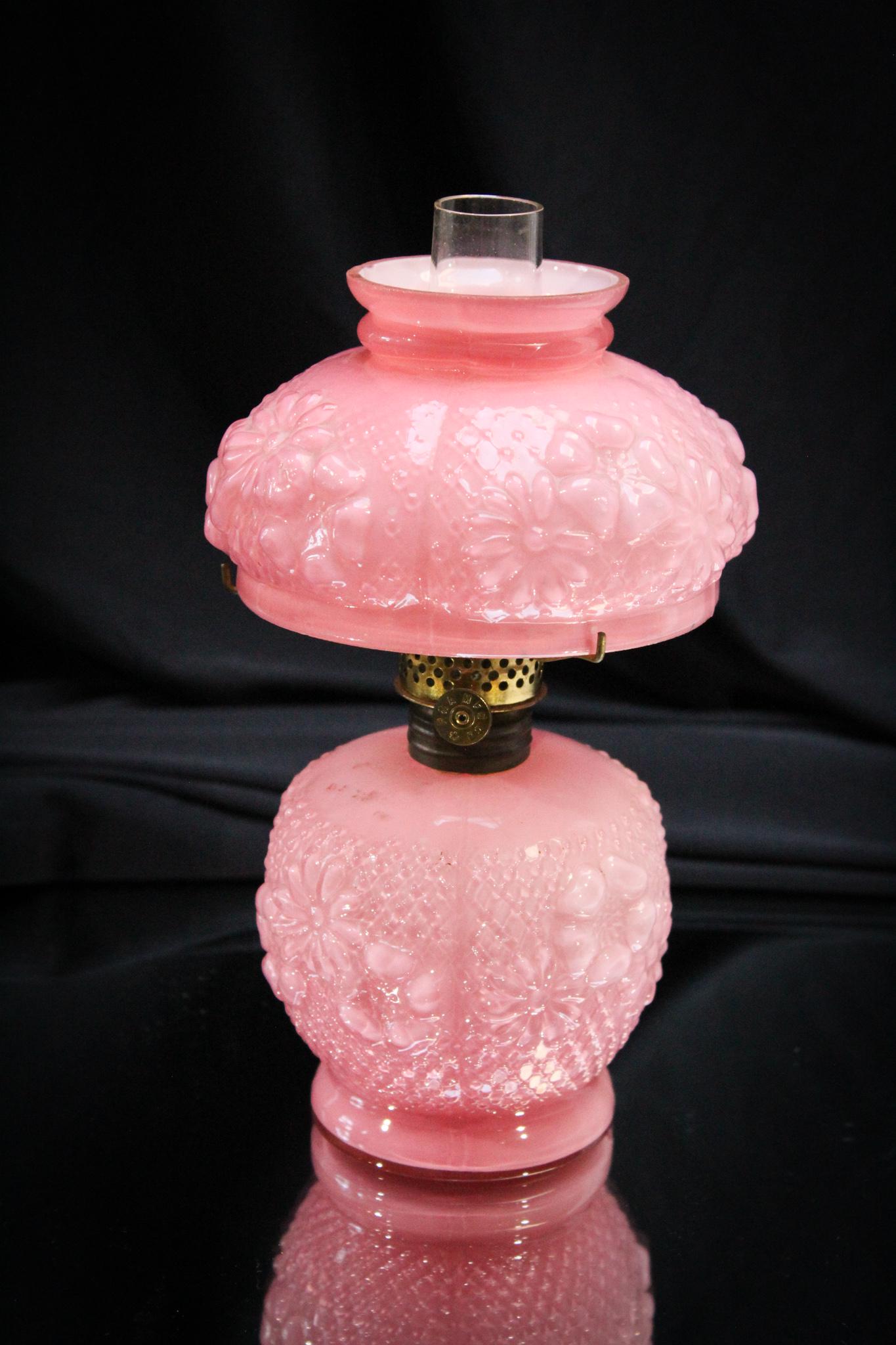 Consolidated Pink Cased Cosmos Miniature Oil Lamp: Cosmos is always a highly collectible pattern, especially when it is in the cased glass color of pink. This is one nice lamp. Measuress 7 1/2" tall.
