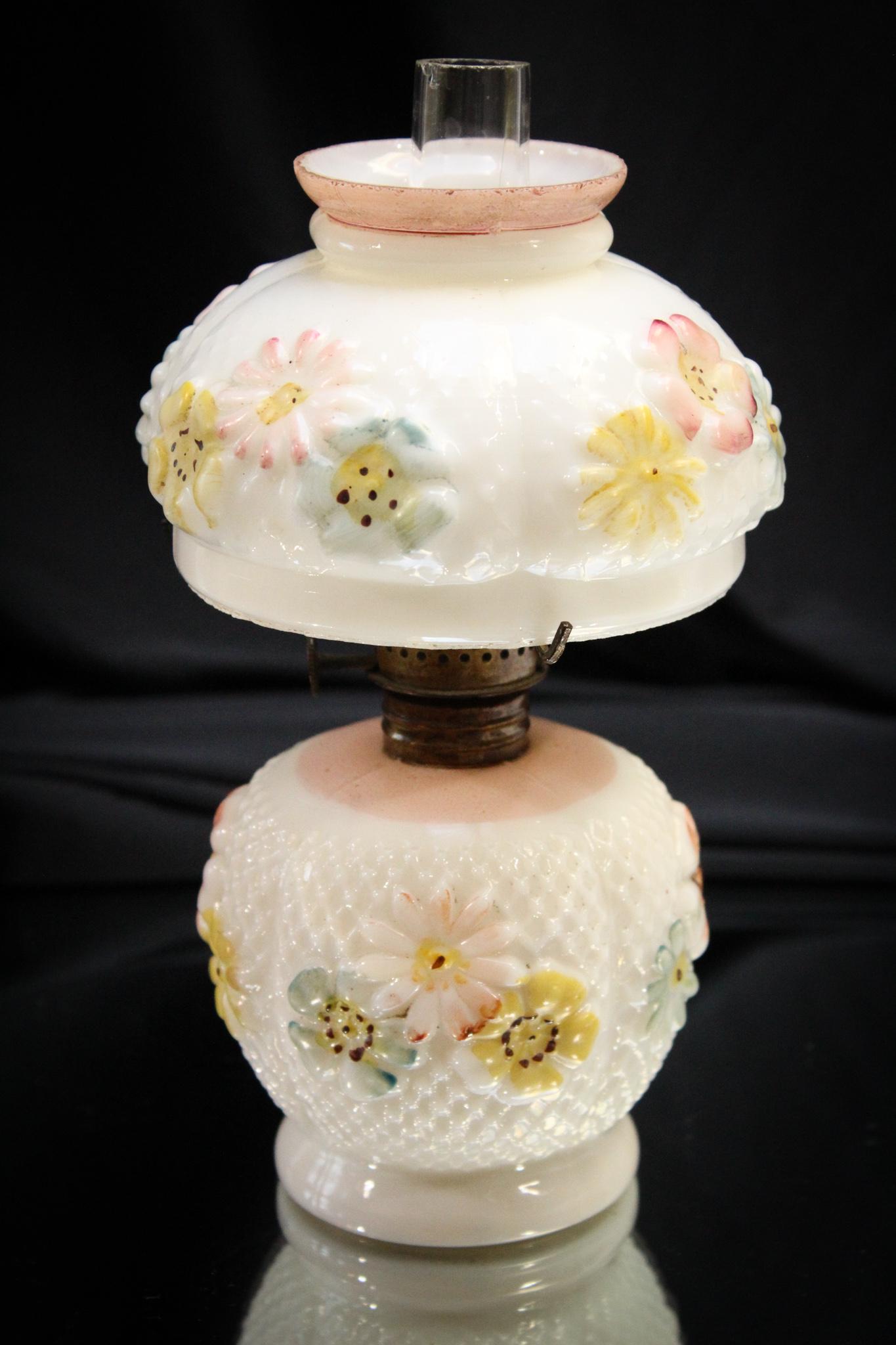 Consolidated Opal Decorated Cosmos Miniature Oil Lamp: Here's another example of the Cosmos pattern. This one is in the decorated opal glass. Nice offering. Measures 7 1/2" tall.