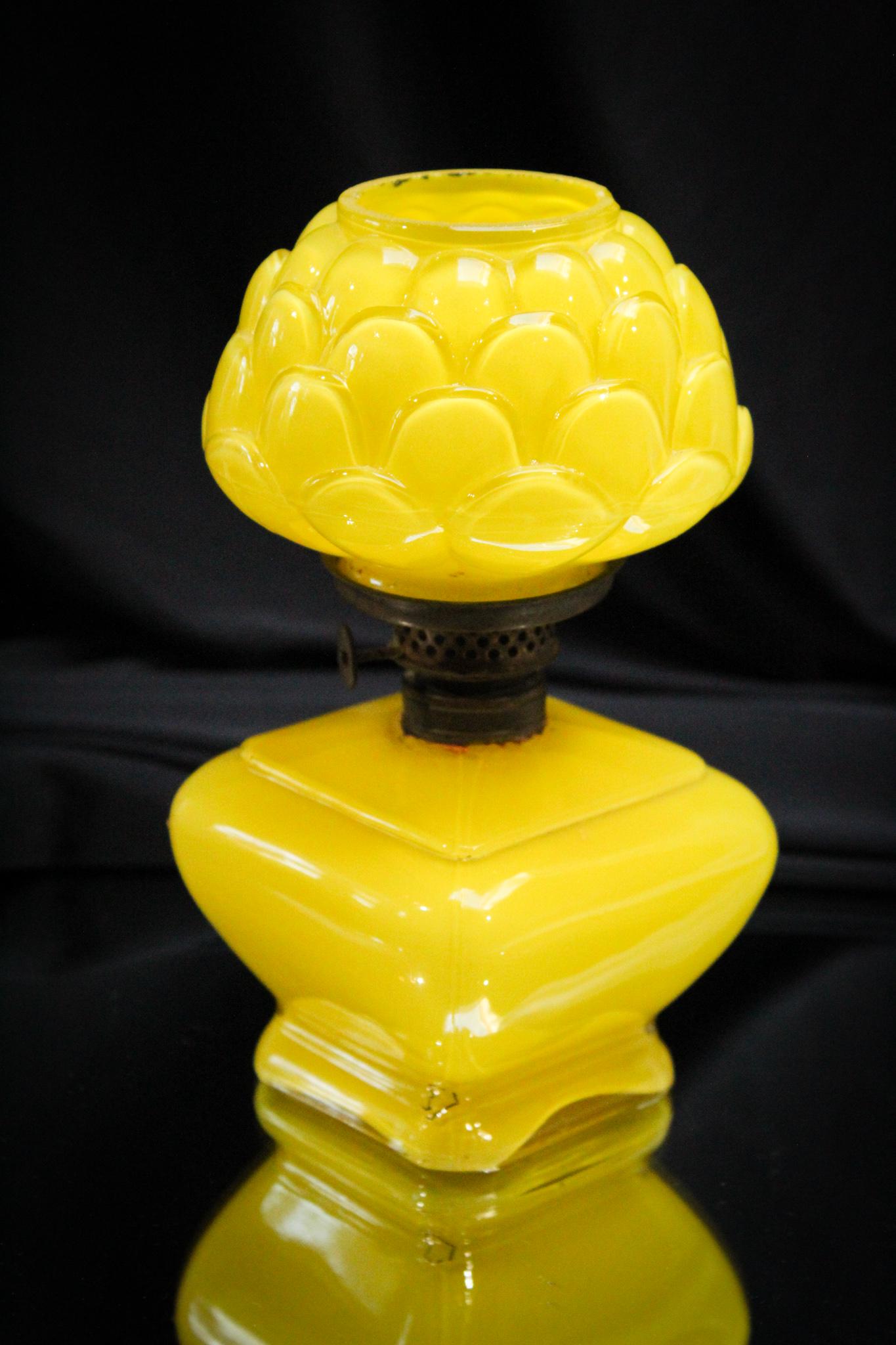 Consolidated Yellow Cased Artichoke Miniature Oil Lamp: What a pretty little lamp this one is. Again in the cased color of brilliant yellow executed in the artichoke pattern. Nice! Measures 7" tall.