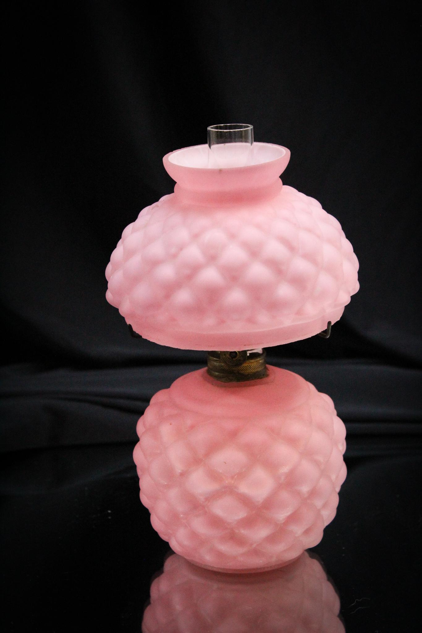 Consolidated Pink Cased Cone Miniature Oil Lamp: This lamp in the ever popular pattern made by Consolidated Lamp and Glass of Fostoria, Ohio is always a find. This one in pink cased glass. We love this little gem. Measures 7 1/2" tall.