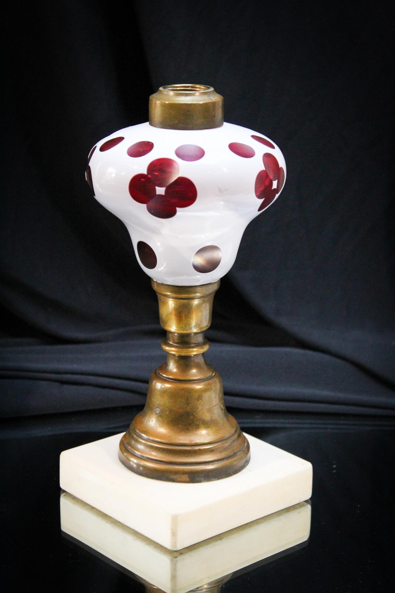 Cranberry Cut Overlay Victorian Oil Lamp w/ Marble: Rich cranberry color with crisp white overlay and cut back design makes up this beautiful Victorian oil lamp complete with original marble base. Killer example. Measures 8 1/2" tall.