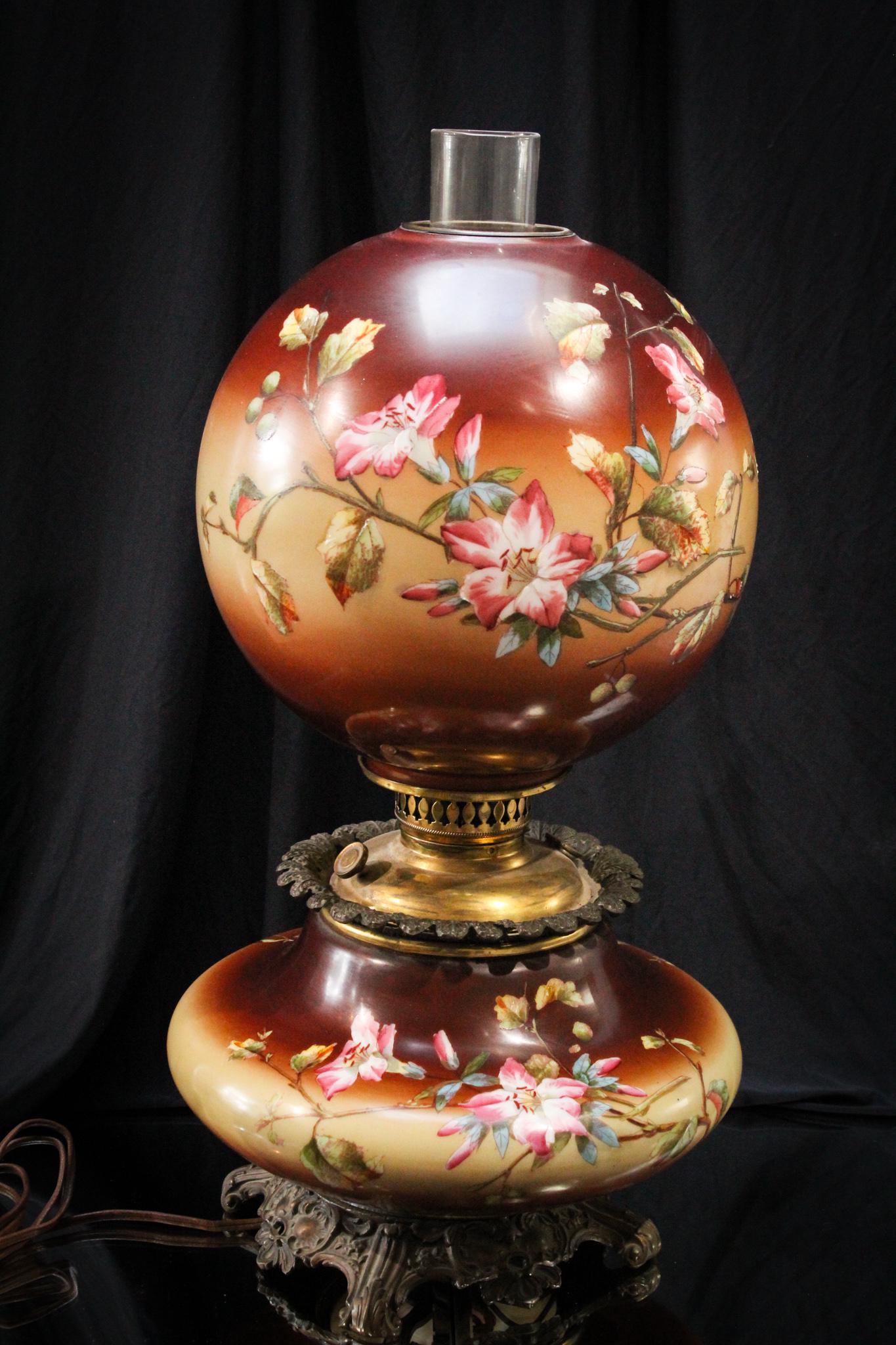 Incredible Victorian Gone With the Wind Parlor Oil Lamp: Deep chocolate brown background and delicate florals adorn this charmer. Nice large lamp with great color and detail. Measures 21" tall.