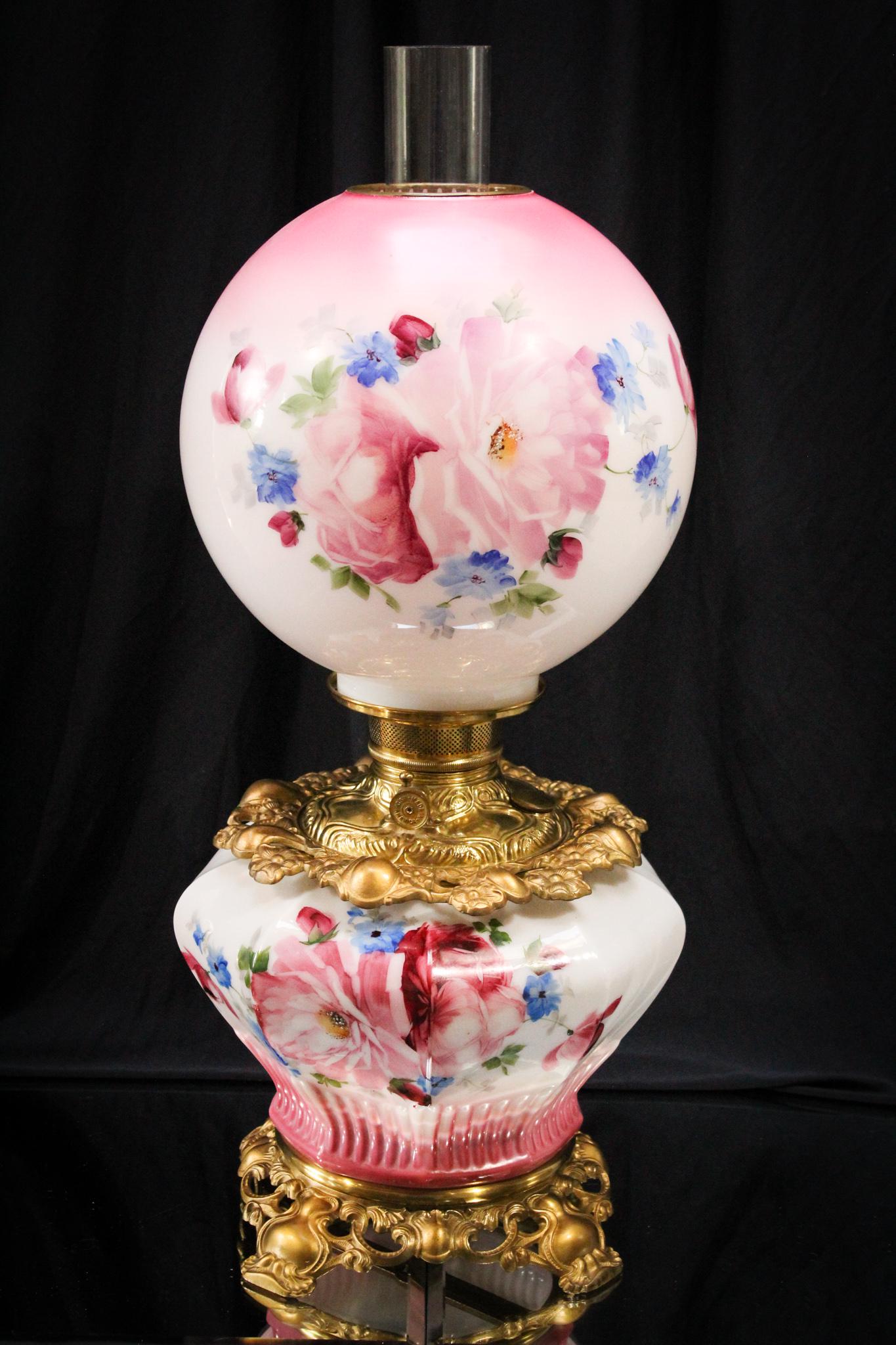 Rare form Victorian Gone With the Wind Parlor Oil Lamp: This is exquisite. The unusual form of the embossed base and the vibrant floral decoration make this a fantastic lamp. It measures 21" tall. Super nice lamp.
