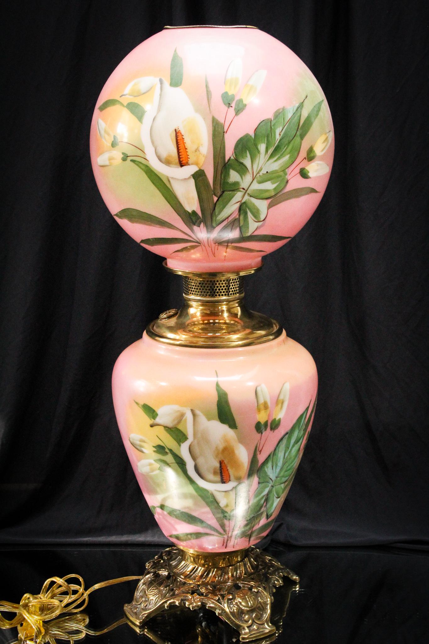 Victorian Calla Lily Gone With the Wind Parlor Oil Lamp: Pretty in pink is this large gone with the wind parlor oil lamp decorated with crisp white calla lilies and foliage. Tall lamp measuring in at 25".