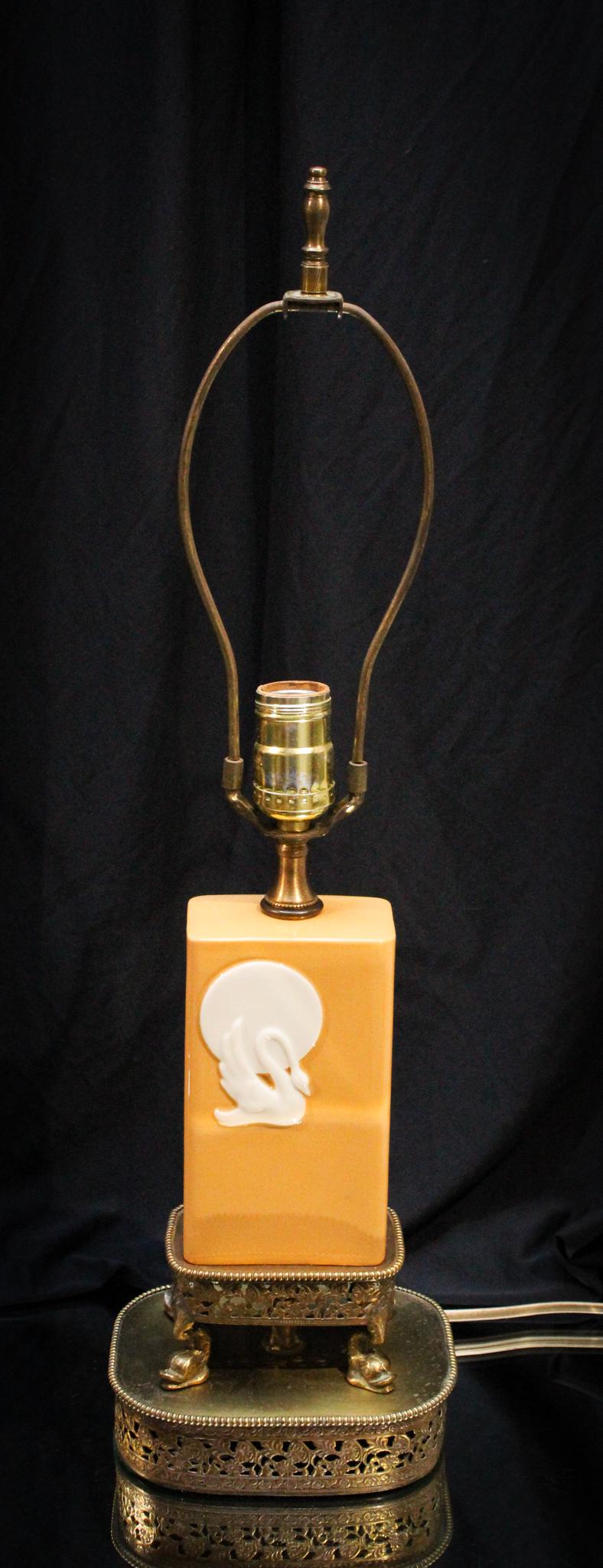 Lenox Porcelain Art Deco Table Lamp: Lovely Art Deco Lenox porcelain swan motif lamp. Beautiful lamp in very interesting Deco form. Complete on original base with dolphin legs. Measures22 3/4" tall.