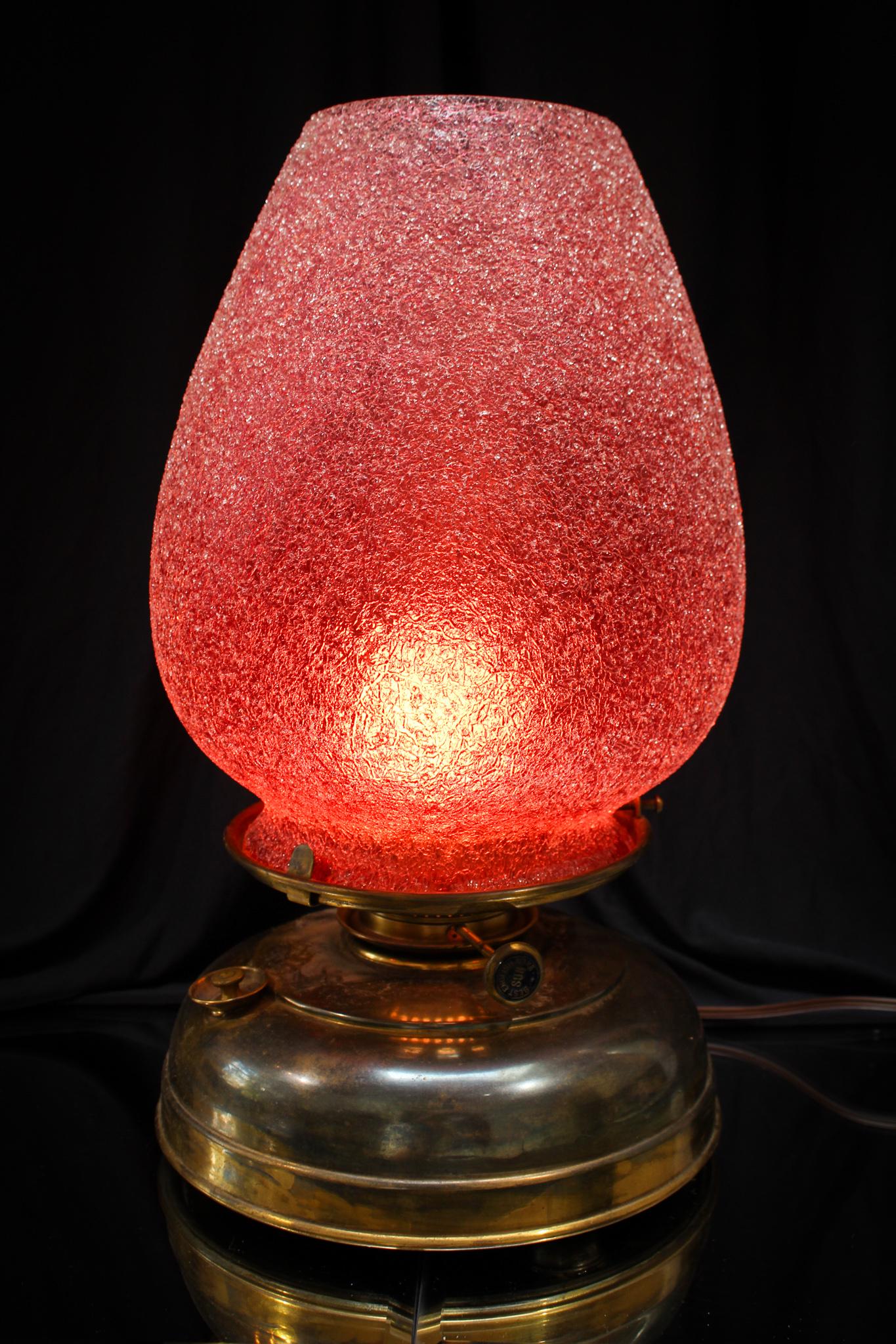 Rare Cranberry Overshot Glass Mariner Oil Lamp: Folks, we don't believe we have encountered a mariner lamp with a cranberry shade with an overshot treatment to the glass. Incredible piece! Measures 16" tall.