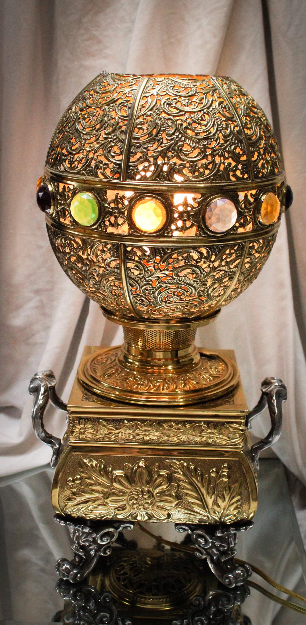 Jeweled Brass Victorian Garish Table Lamp: Oh my! We need our sunglasses for this one folks. The highly prized brass making up this must have piece of over the top Victoriana is so shiny, you can see your reflection. Very ornate? Yes, yes it i