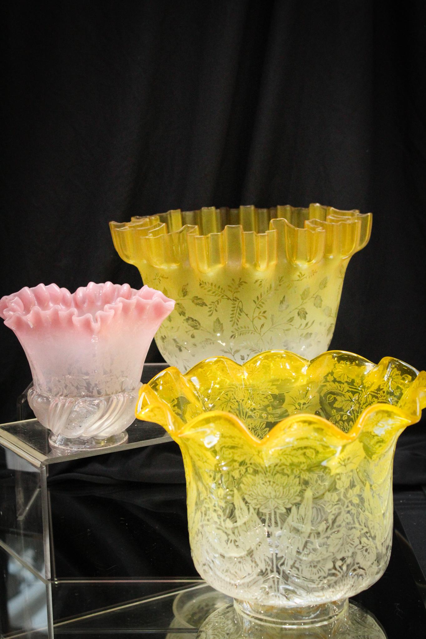 3 pc. Lot Victorian Art Glass Shades: Great lot of 3 Victorian art glass shades. Two yellow to clear with etching, and one pink to clear etched. Crimped edge measures 5" tall, 8" wide, and 4 7/8" fitter diameter. Ruffled edge shade measur