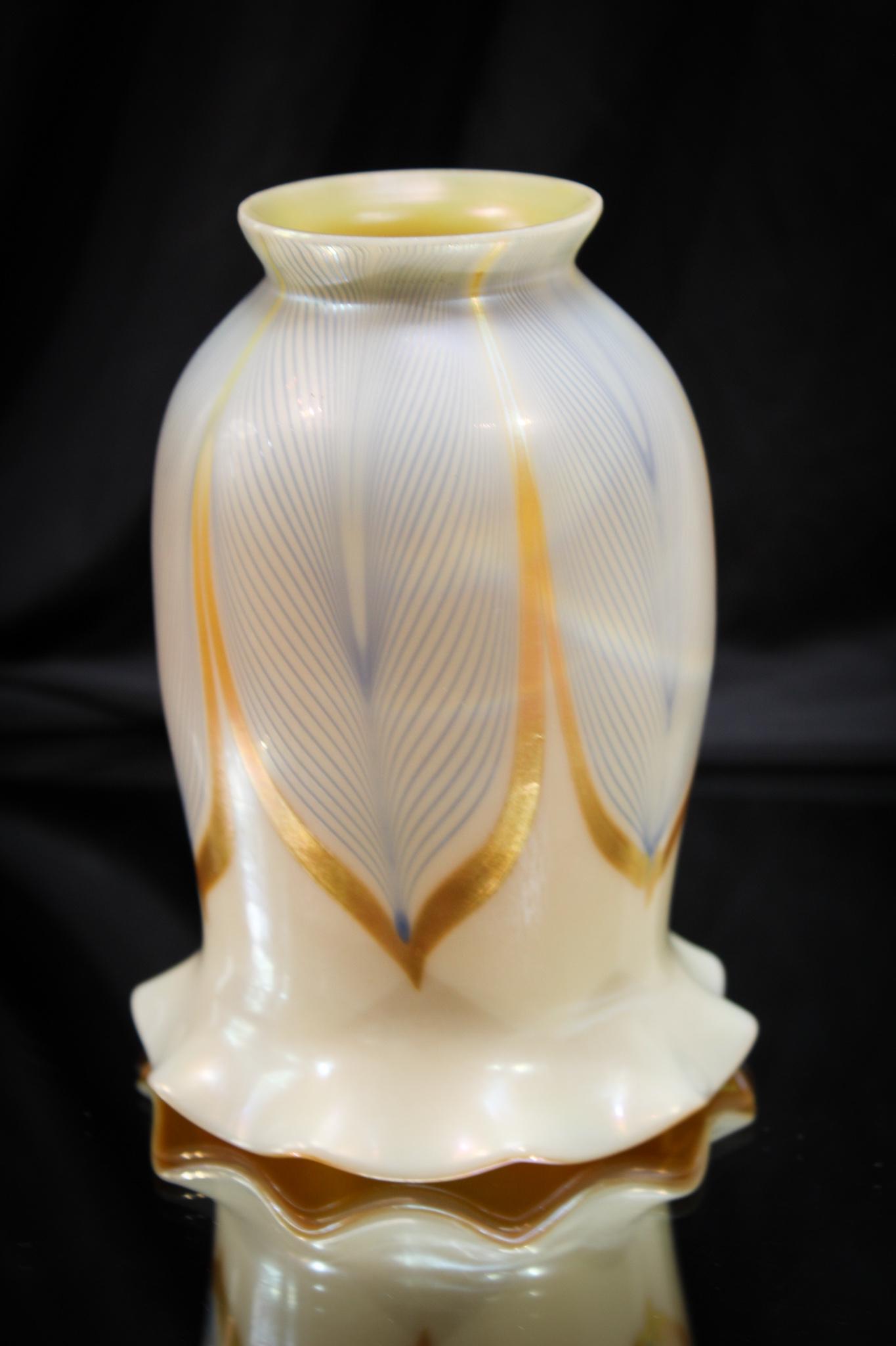 Steuben Quezal Pulled Feather Art Glass Shade: Rich unsigned Steuben or Quezal pulled feather pattern art glass shade. Brilliant example. Measures 5 3/4" tall, 4 1/2" wide, and fitter rim of 2 1/4".