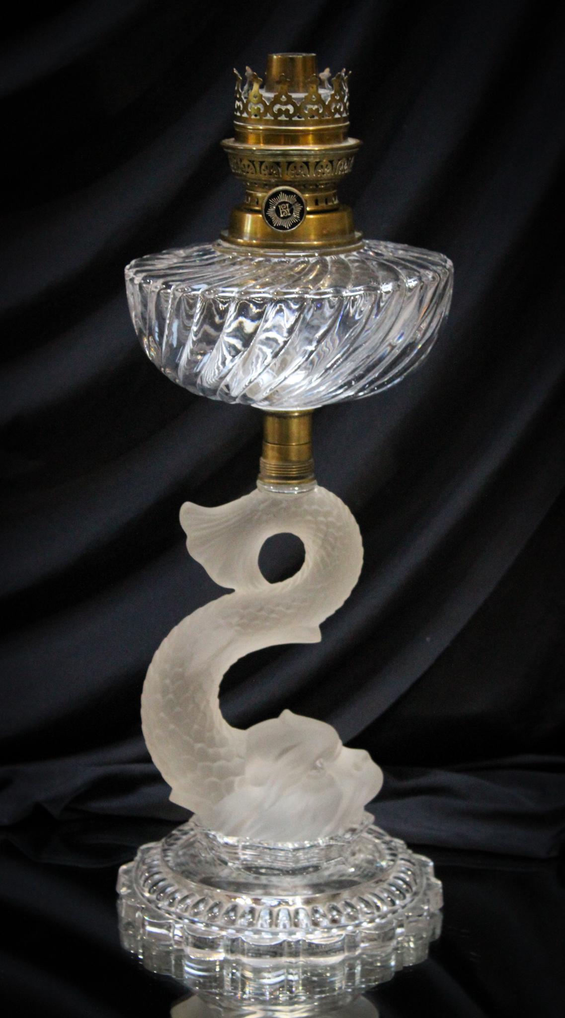 Baccarat Dolphin Stem Victorian Oil Lamp: Attributed to Baccarat, this massive oil lamp features a frosted dolphin stem. Impressive piece. Measures 14" tall.