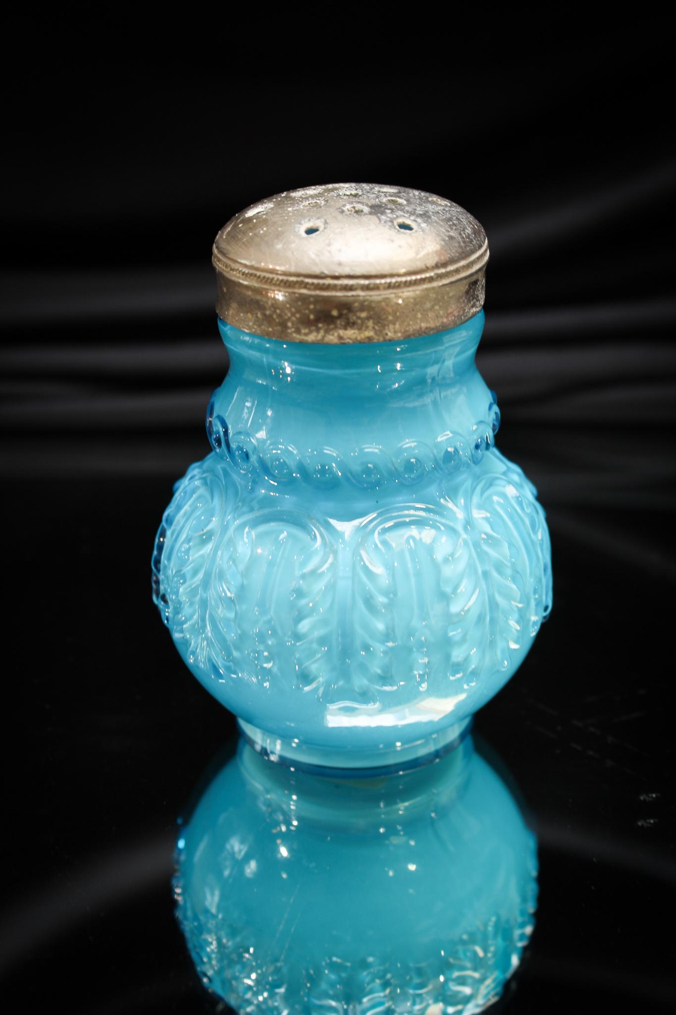 Northwood Blue Leaf Umbrella Salt Shaker: Vivid electric blue is the color of this special piece. One of the favorite Northwood patterns among the collectors. This one measures 3" tall. Nice!