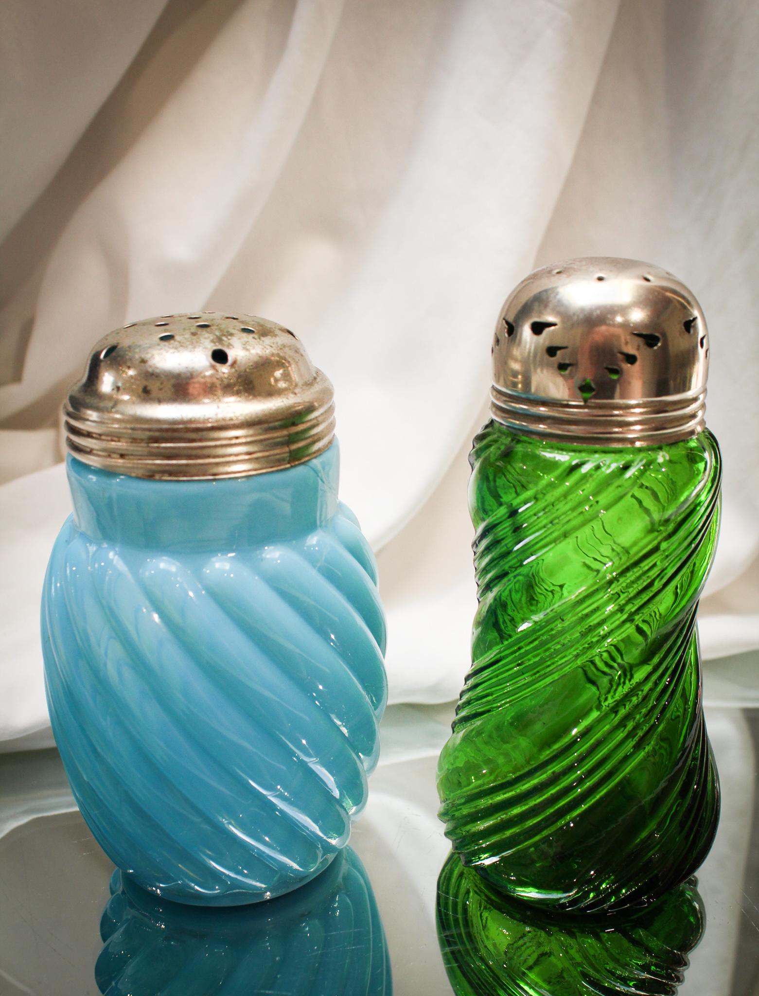 2 pc Lot Victorian Glass Sugar Shakers: Two lovelies of the Victorian period here folks. A green English ridged swirl and an opaque blue Reverse Swirl Mold example paired together for simple joy and pleasure. Tallest measures 5 1/2".