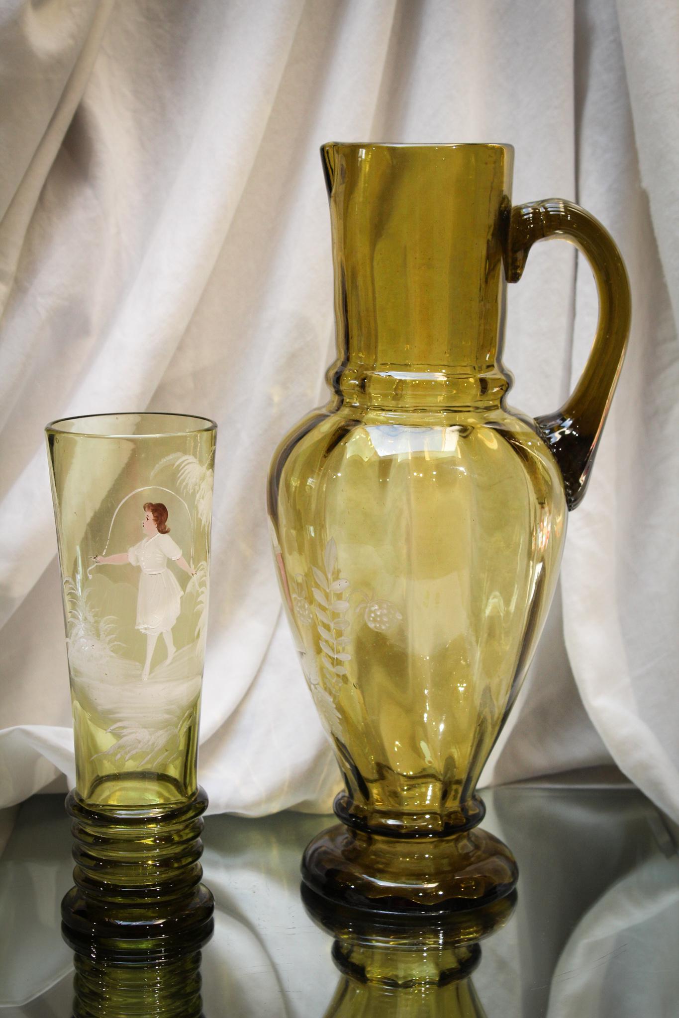 Victorian Mary Gregory Enameled Tankard Pitcher & Tumbler: Gorgeous Honey Smoke amber color to this very tall tankard style pitcher and coordinating tumbler. Both examples of the best Mary Gregoryania around. Pieces are expertly detailed with crisp white enam