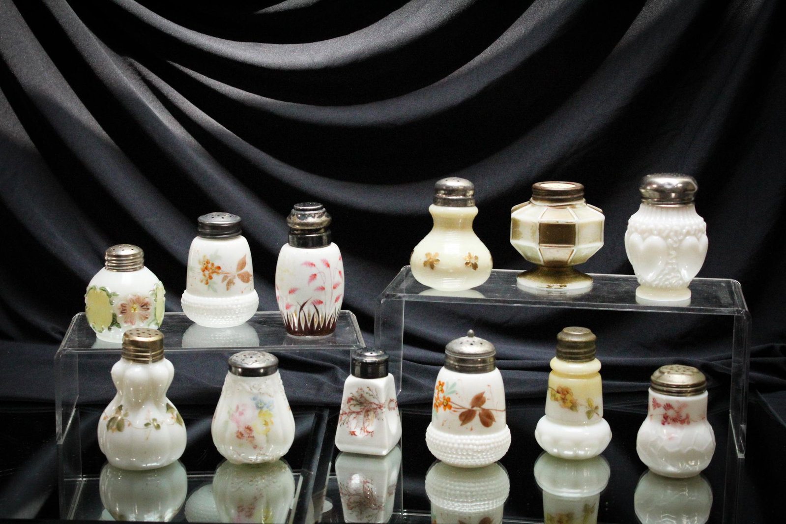 12 pc. Lot Victorian Milk Glass Salt Shakers: What candy for the eyes of the Salties out there this is. We're sure there are some special goodies in this lot you won't be able to resist. We could be wrong, but alas, we have not been yet. Tallest 