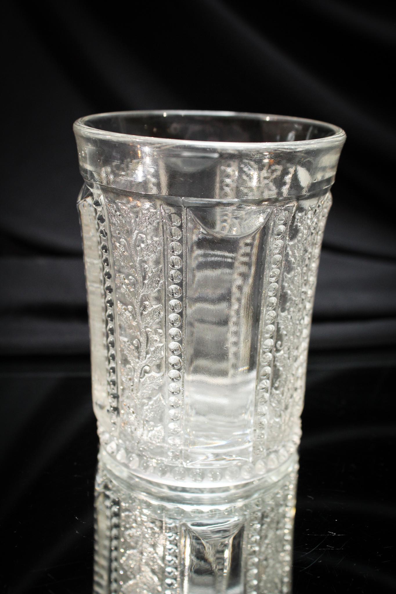 Greentown Victorian Glass Clear Holly Tumbler: We're proud to offer some of the finest Greentown glass that has come to market. Folks, this is a toughie. Don't you think? A Greentown glass Holly pattern Victorian tumbler. Measures 4" tall.