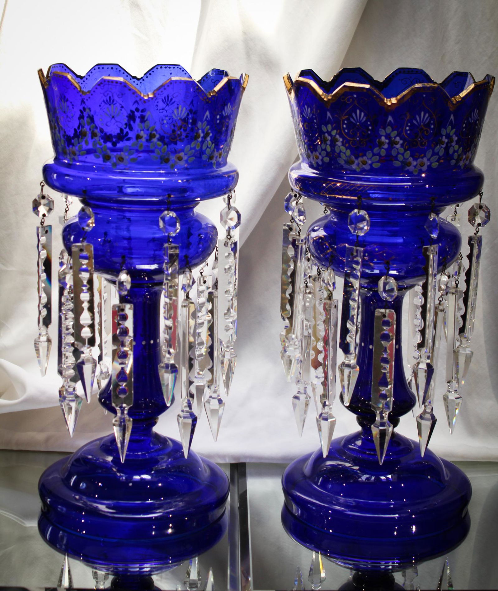 Magnificent Pair 15" Cobalt Victorian Glass Mantle Lusters: Folks, these are simply are over the top incredible with the best cobalt coloring and gilt and enameled decoration. Lusters have two complete rows of long prisms. Measures a large 15" tall. Killer!
