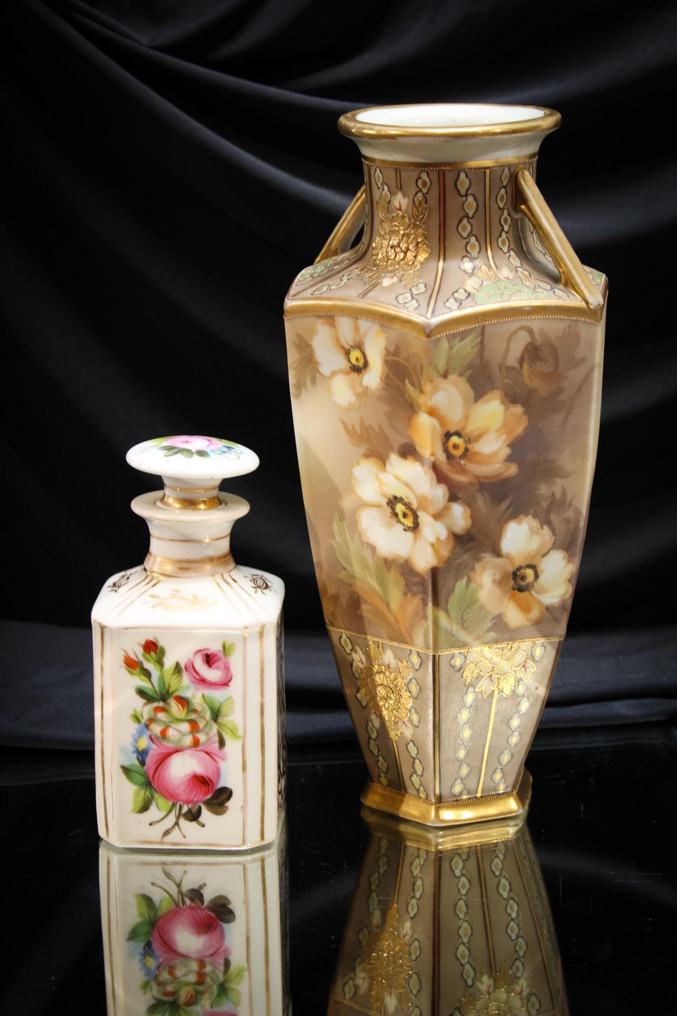 2 pc. Lot Porcelain Nippon and More: Great pairing of two pieces of porcelana. One is a Nippon florals and gold decorated vase and the other a nice old toilet bottle. Tallest measures 11".