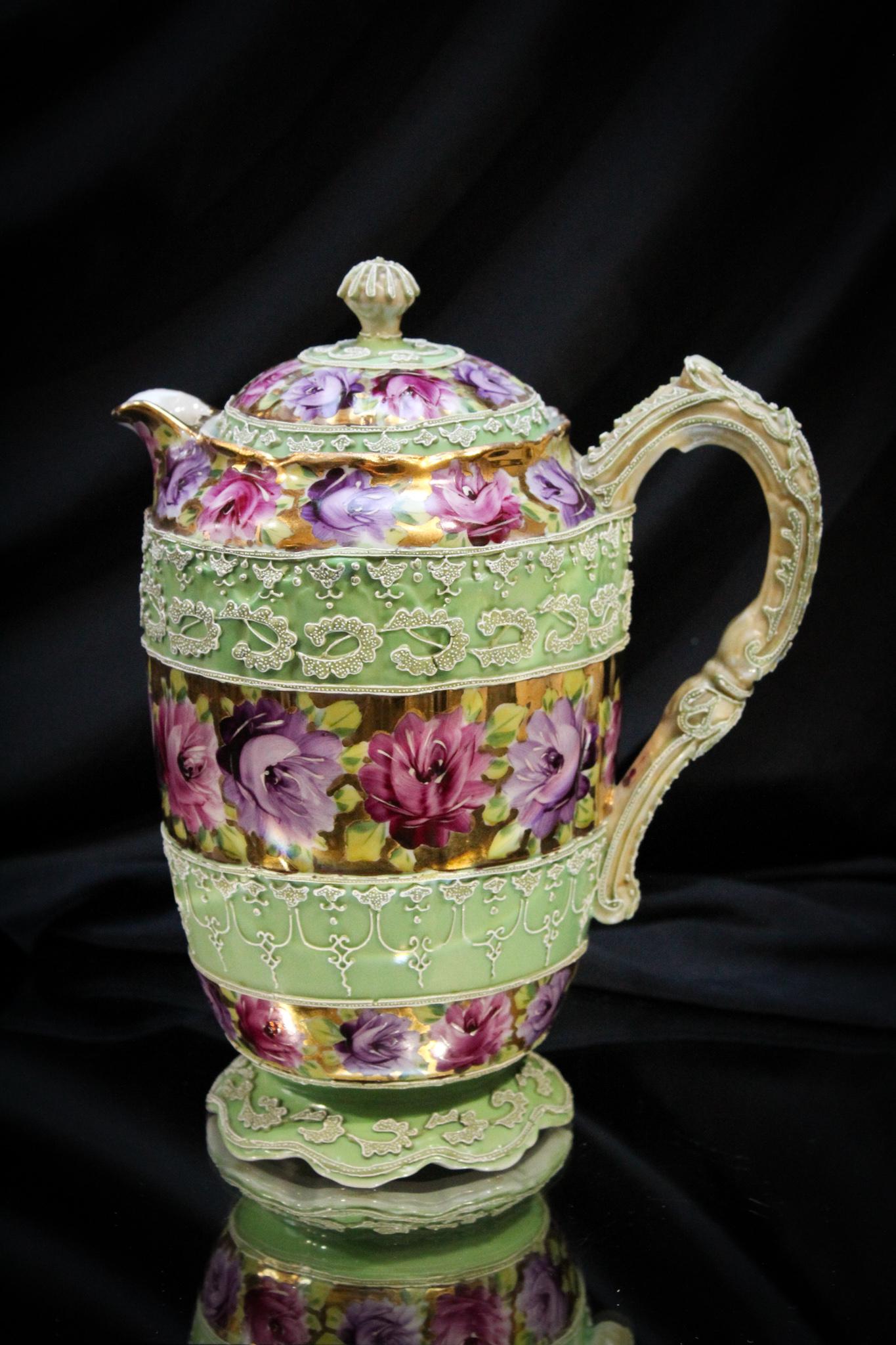 Nippon Moriage Purple Roses Teapot: Time for tea? You betcha with this super offering for tea time. Here's a Nippon Moriage dÃ©cor teapot. Lots of purple roses make this piece all that and then some. Measures 10" tall.