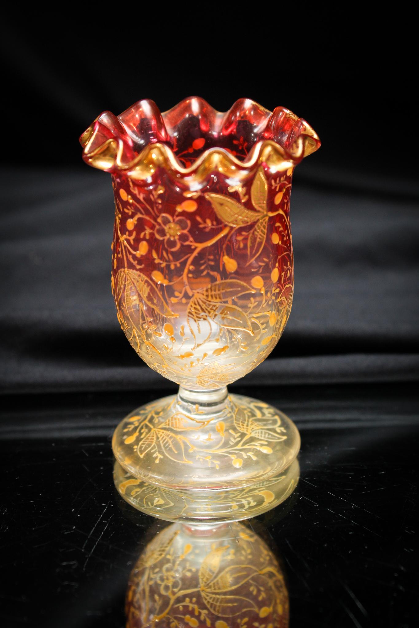 Victorian Moser Enamled Glass Toothpick Holder: A superior piece! This cranberry pedestal form toothpick is attributed to Moser. Lovely floral enameling and gilt decoration. What a prize this will be in your collection. It measures 2 7/8".