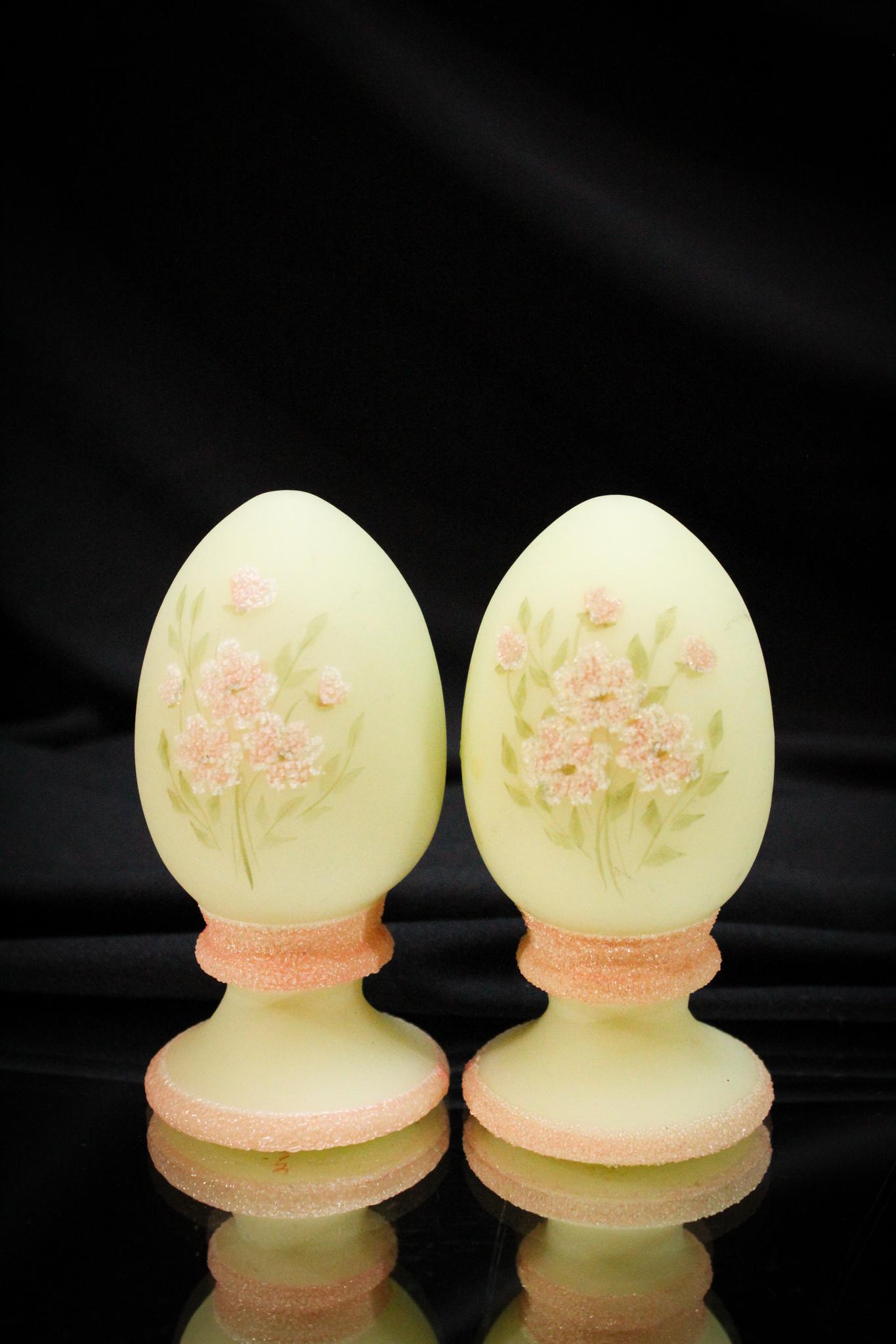 2 pc. Lot Fenton Custard Glass Decorated Eggs: Charming and collectible. That's what these little guys are. Each decorated a little different. Each measures 3 1/2" tall.