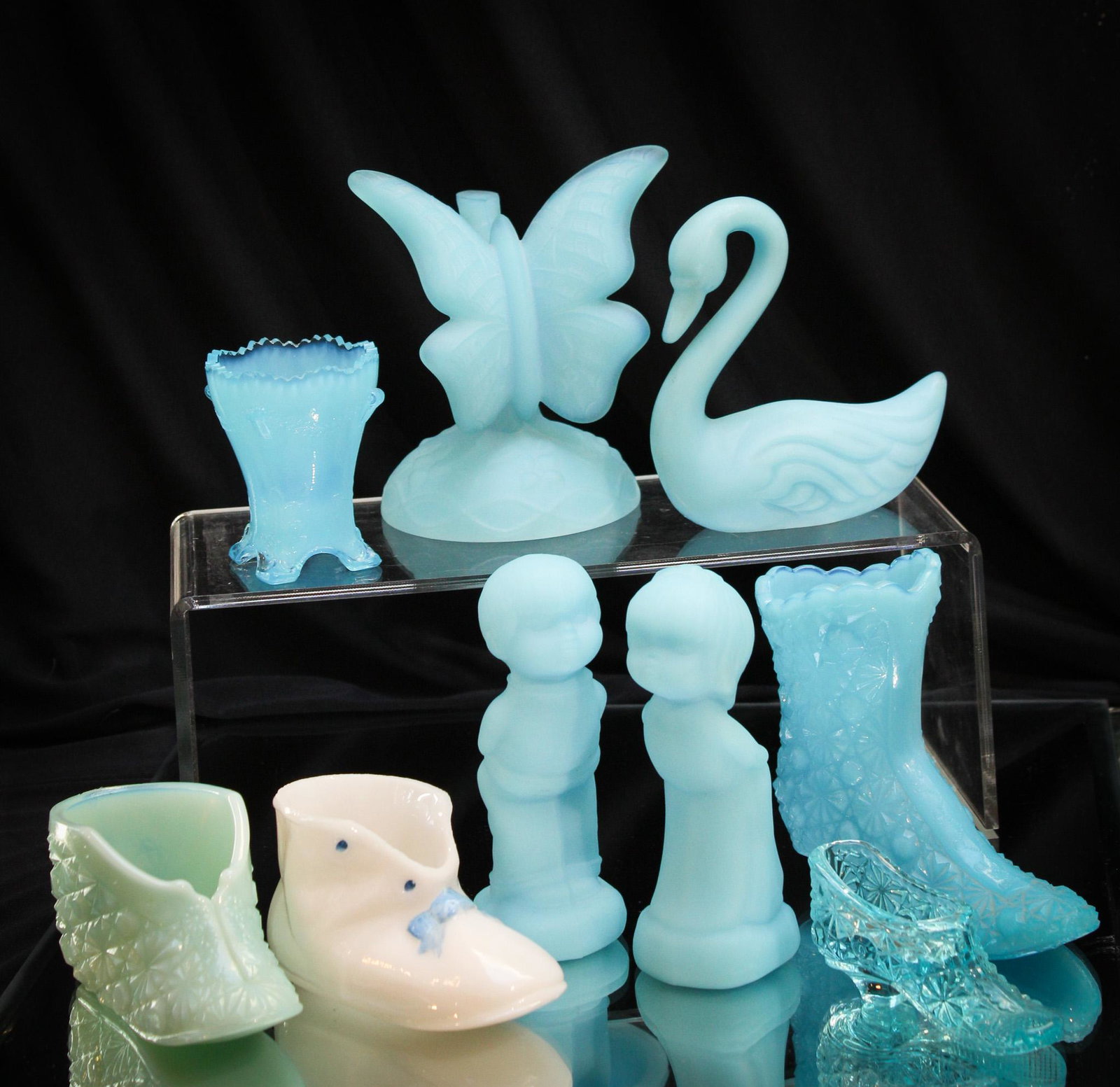 Mega Magnum Auctions 10 pc Lot Fenton Art Glass: Wowza folks. Look at the beautiful blue of these desirable and more pieces of Fenton Art Glass. Something for all the grannys in your life. You know how they love this stuff. Tallest measures 4 3/4".