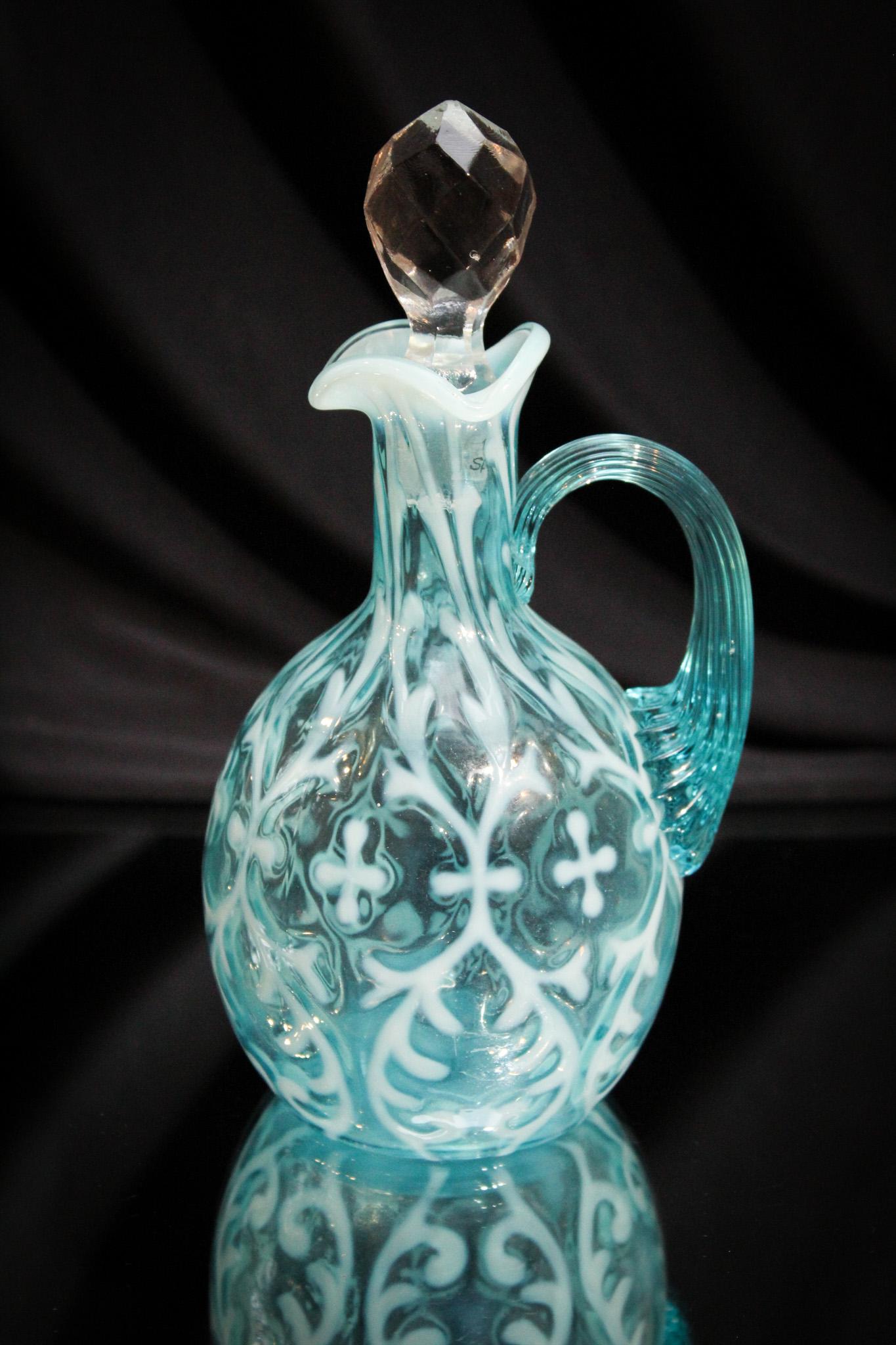Victorian Northwood Blue Spanish Lace Cruet: Such a nice piece for your collection. Here's a blue opalescent spanish lace cruet that is sure to please. It measures a whopping 7" tall.