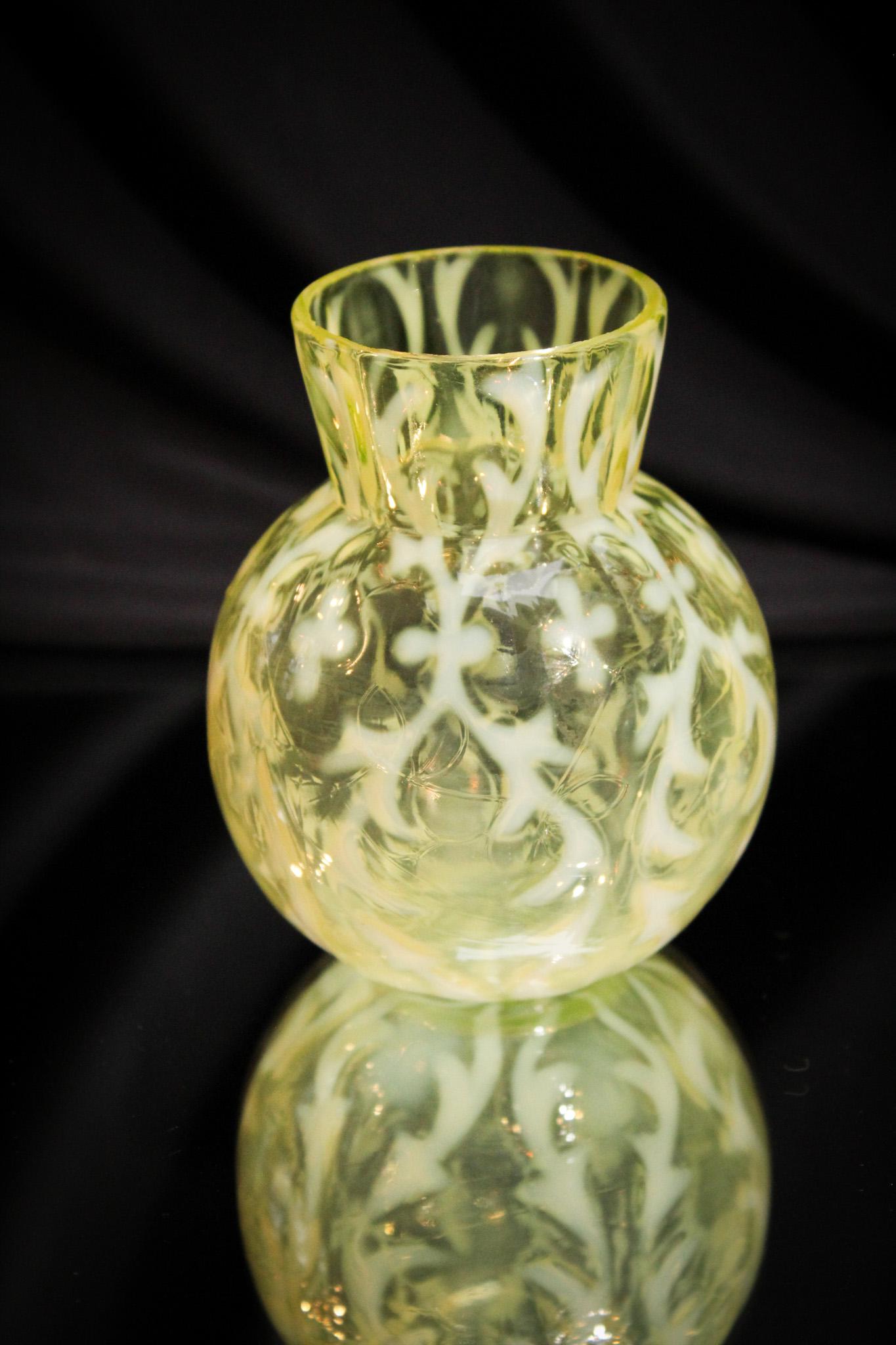 Victorian Vaseline Opalescent Spanish Lace Vase: Victorian Opalescent Spanish lace diminutive vase. Nice piece being a great size to fit in anywhere. If you're a size queen, this one may not be for you. It's a gem. It measures 4 1/4" tall.