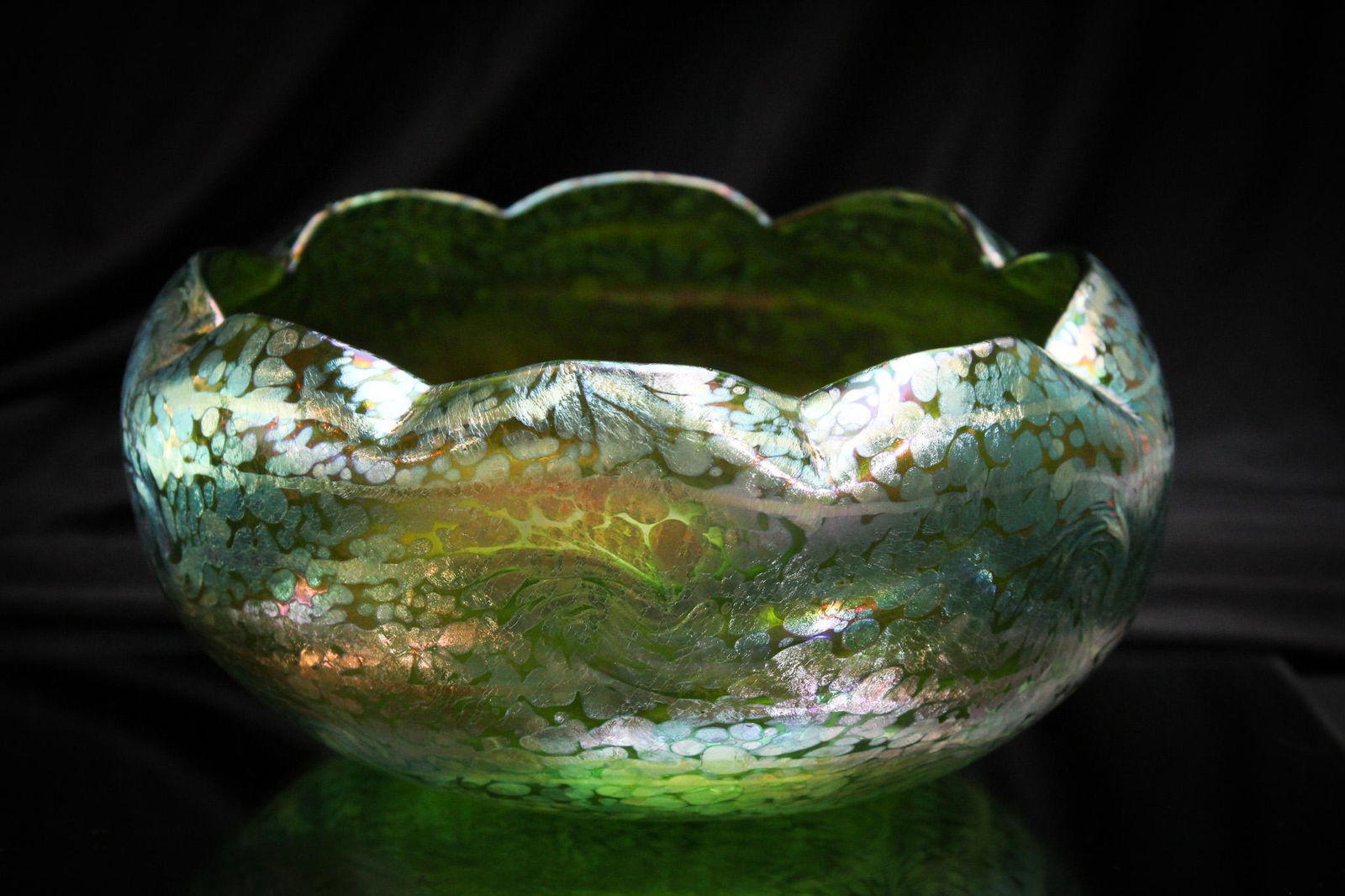 Fritz Heckert Irridescent Art Glass King Tut 8" Bowl: Scrumptious best describes this gem of a find. Great piece of Fritz Heckert in the King Tut pattern. Bowl has super coloring. It measures 4" tall, 8" wide.