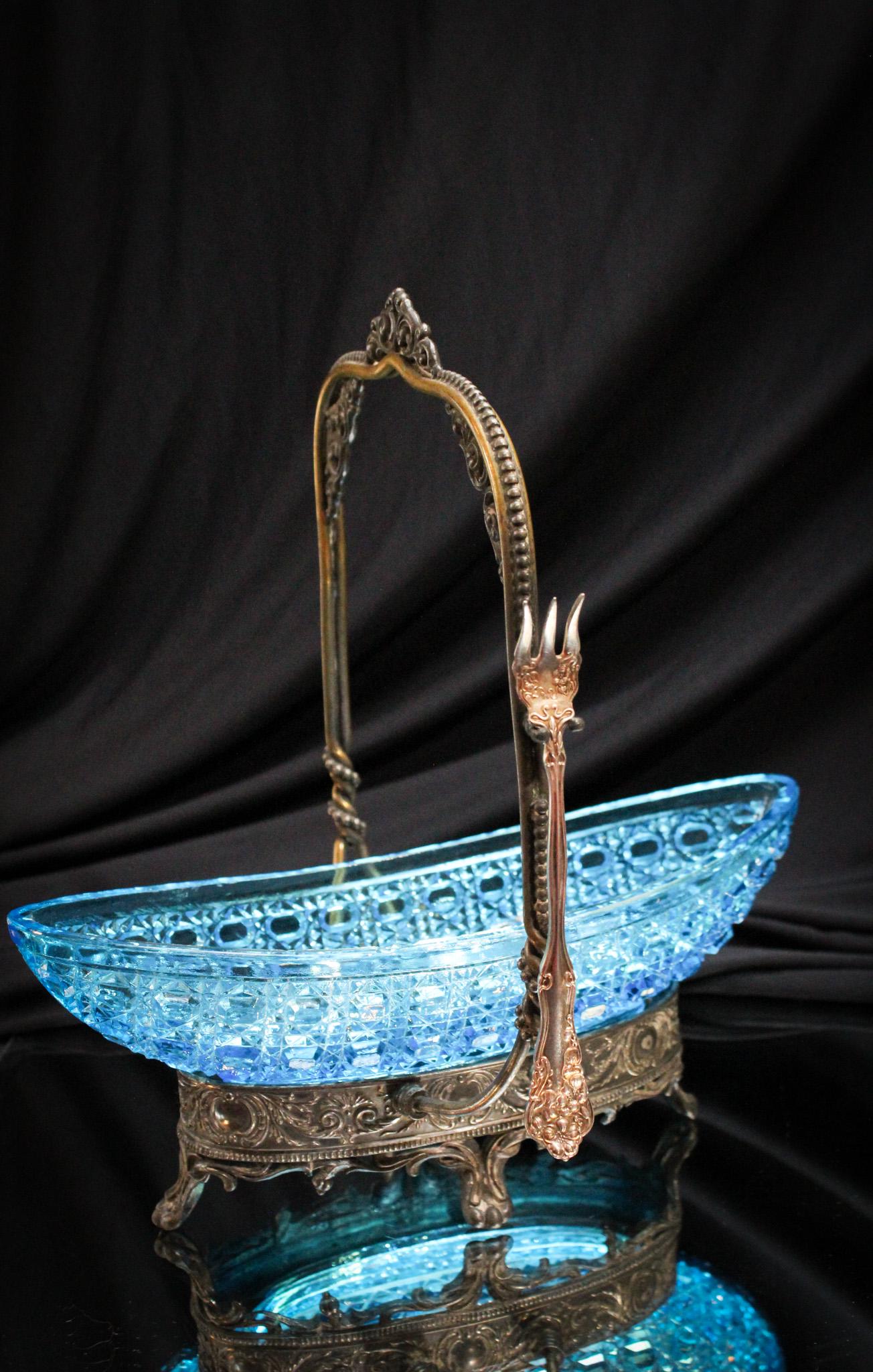 Electric Blue Silverplate Victorian Rhubarb Castor: Completely original, we are proud to offer this all-original electric blue boat in ornate silverplate holder rhubarb castor. Piece is amazing with the best coloring. It measures 10 1/4" tall.