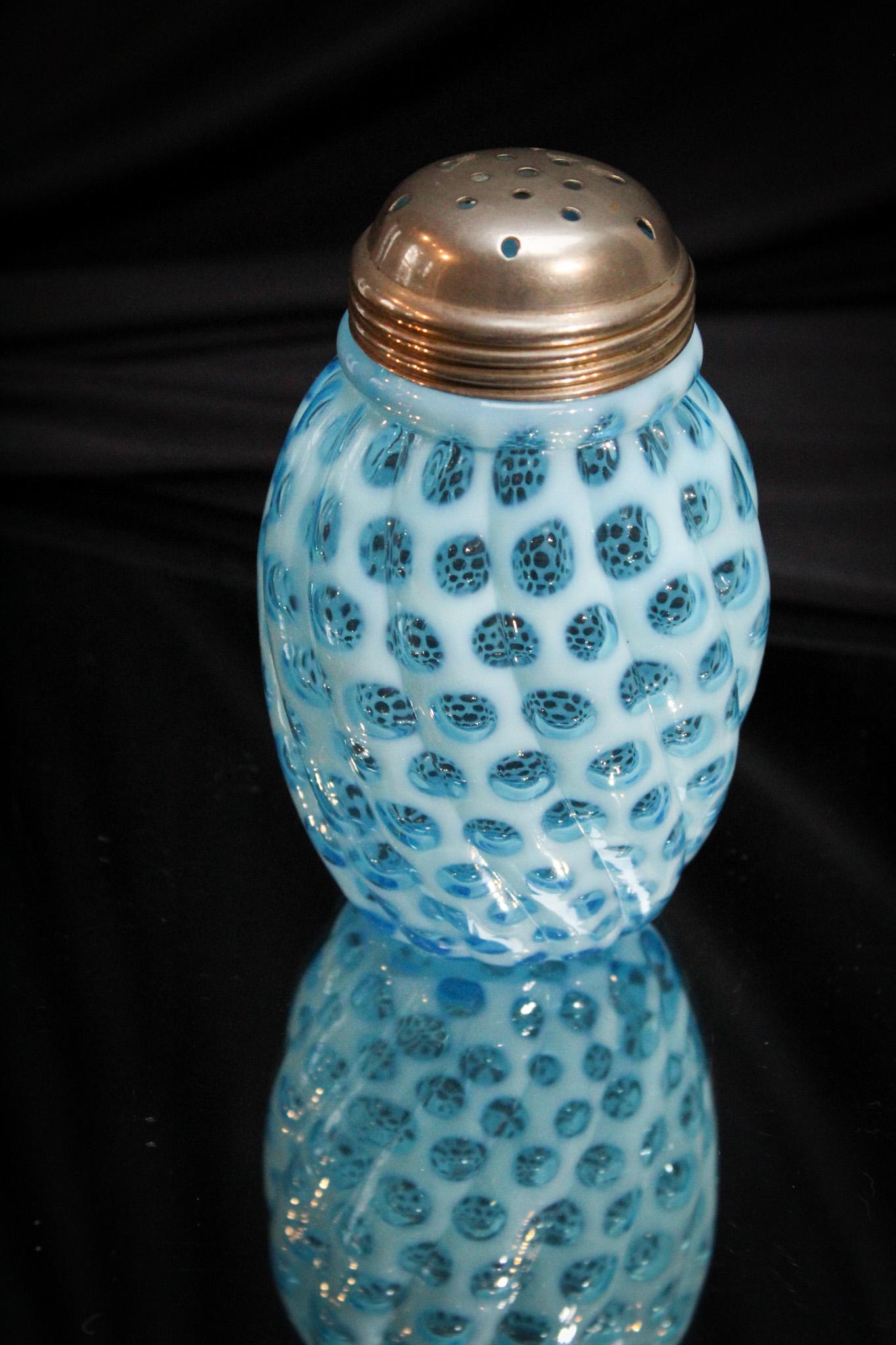 Hobb's Blue Opalescent Victorian Glass Sugar Shaker: Look at the color and the opalescence on this sugar shaker! So gorgeous. It is a must have example. Superior examples abound at, well you guessed, Magnum Auctions! This toughie measures 5 1/4" tall.