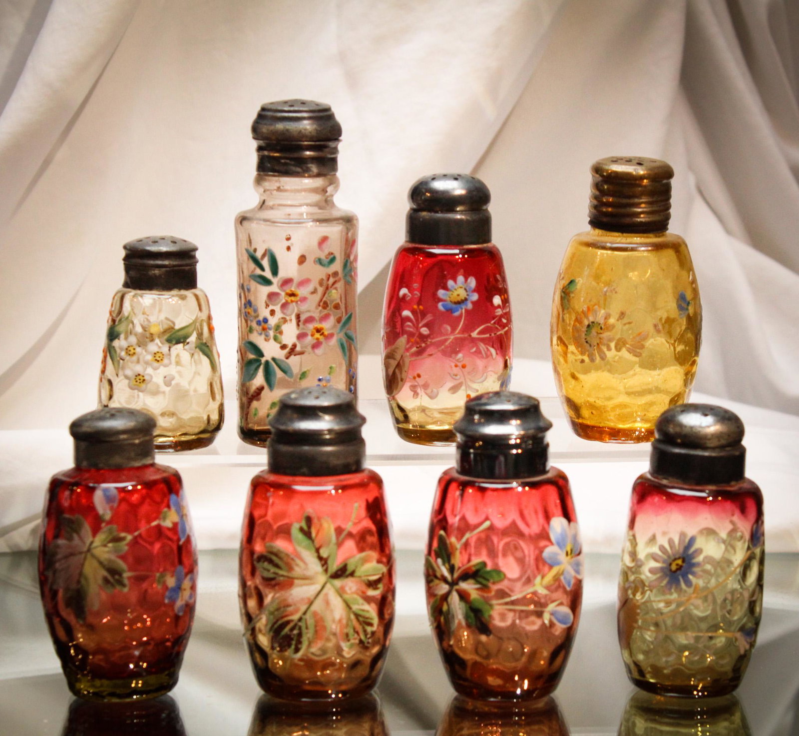 8 pc Lot Victorian Amberina & Amber Enameled Salt Shakers: Super grouping of 8 Victorian enameled salt shakers in amber and amberina glass. So much pleasure and eye candy in one lot. Presented by none other than your favorite auction, Magnum Auctions! Tallest