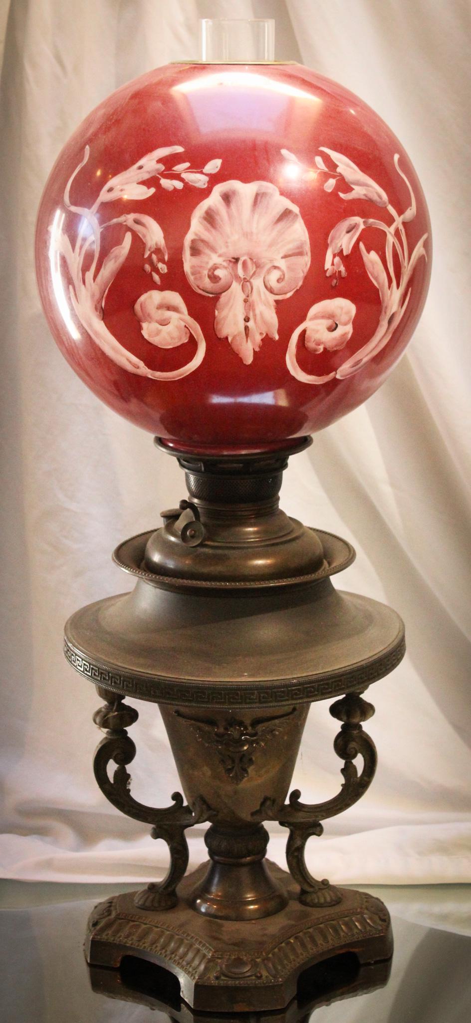 Victorian Maroon Banquet Oil Lamp: Amazing Victorian oil lamp with ornate base with handles and hand painted shade in maroon color with shell and scrolling on either side. Untouched original finsih adds to the charm of this wonderful l