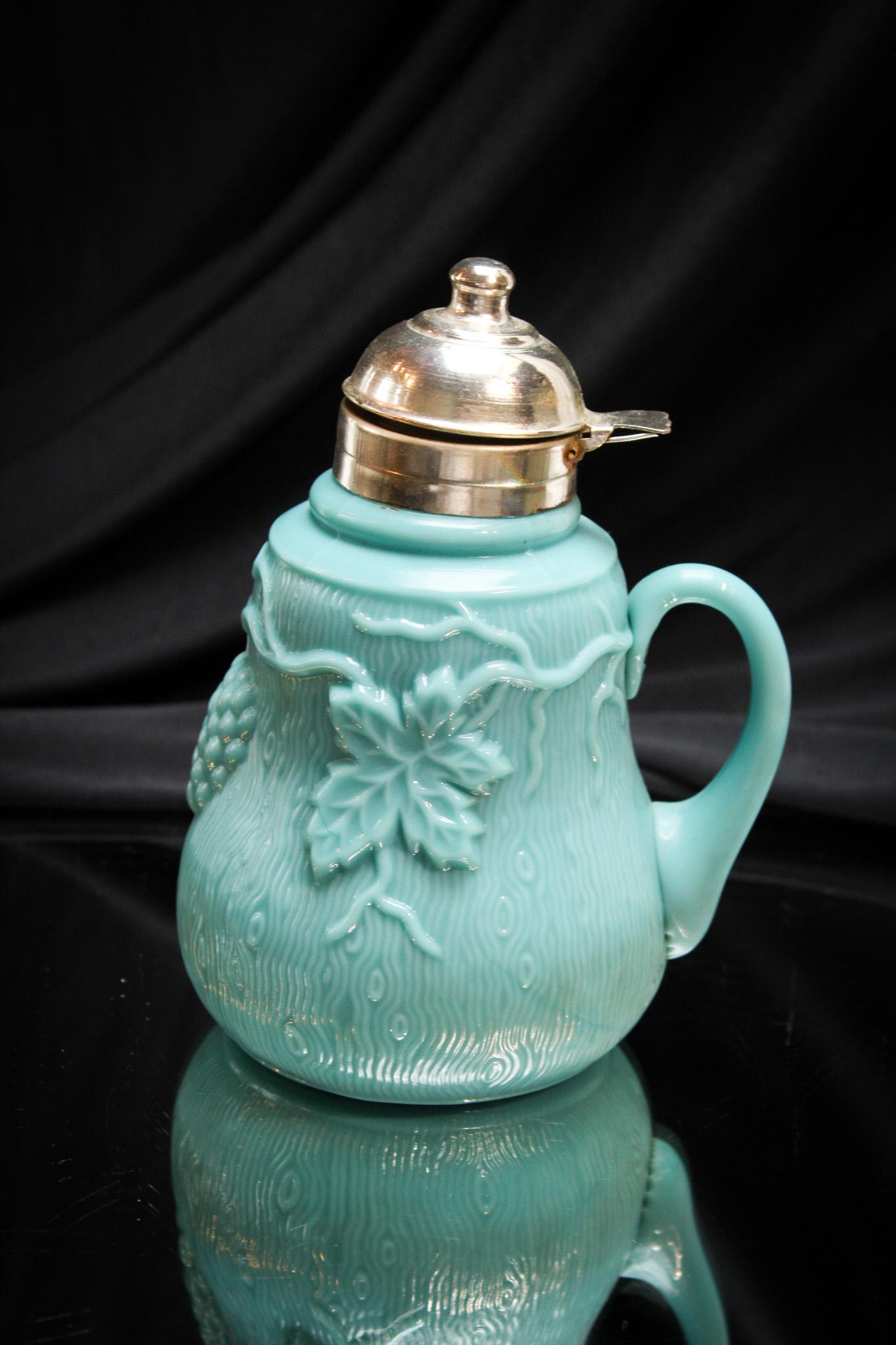 Northwood Grape & Leaf Victorian Syrup Pitcher: Great pattern Victorian Syrup Pitcher. Nice color and great addition to any collection. It measures 6 1/4" tall.