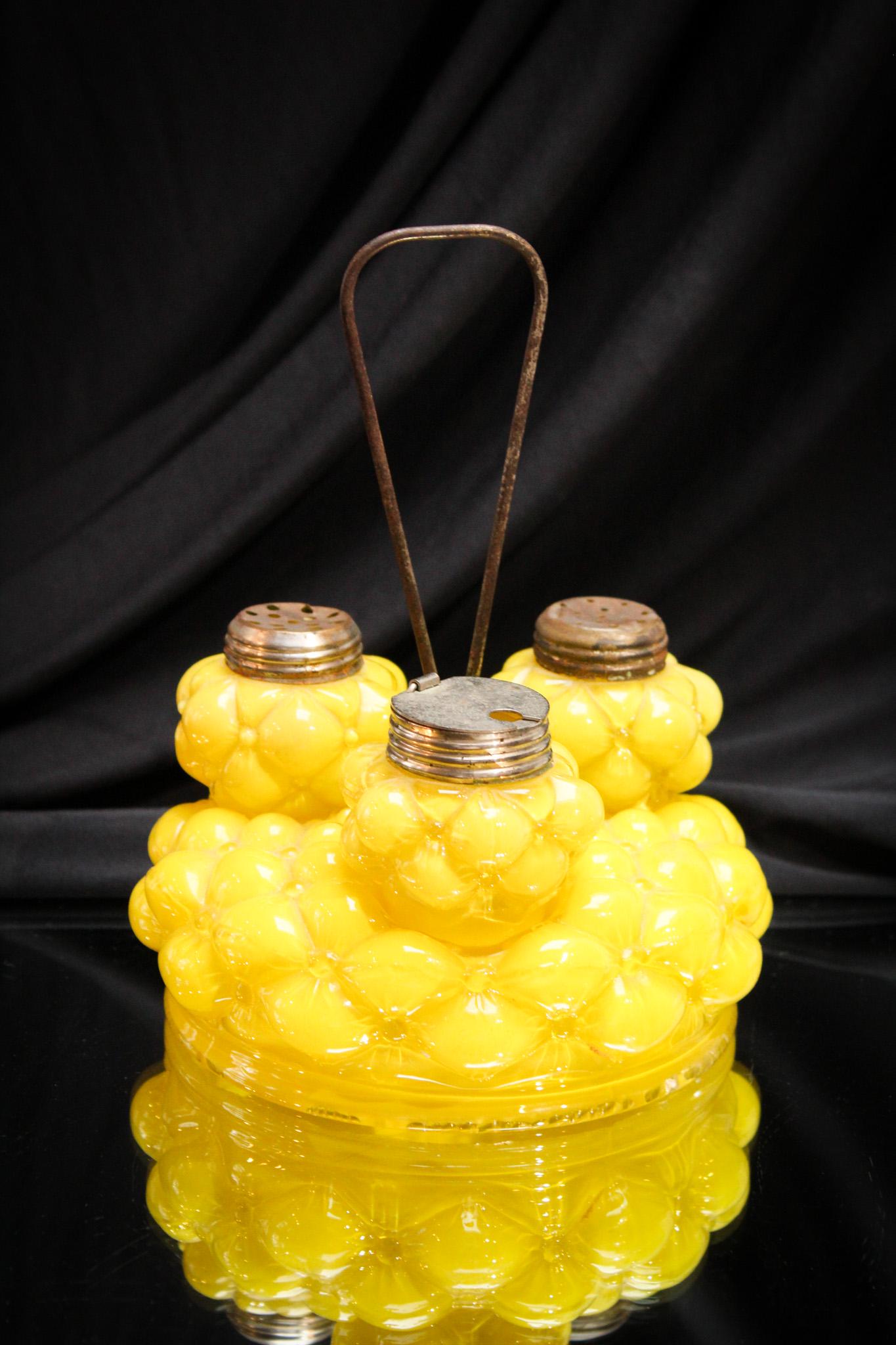 Consolidated Yellow Cased Florette Shaker Condiment: Crisp Canary yellow was a signature staple of Consolidated glass. This is a classic example of just that in the Florette pattern. Complete with matching base. Tallest measures 7 1/2" tall.