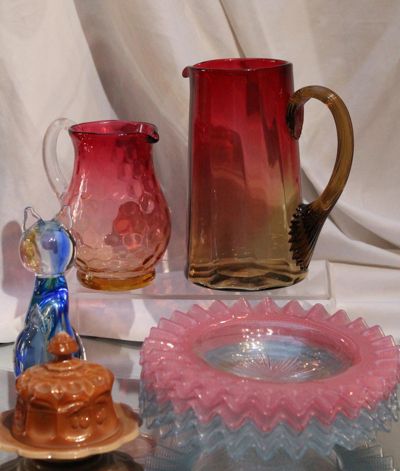 10 pc Mega Magnum Auctions Lot of Art Glass: How do we put together such phenomenal lots like this? Simple. Esmerelda, our 102-year-old Packing Manager throws spit wads at the shelf and where they land is what we put in the lot. It's as simple a