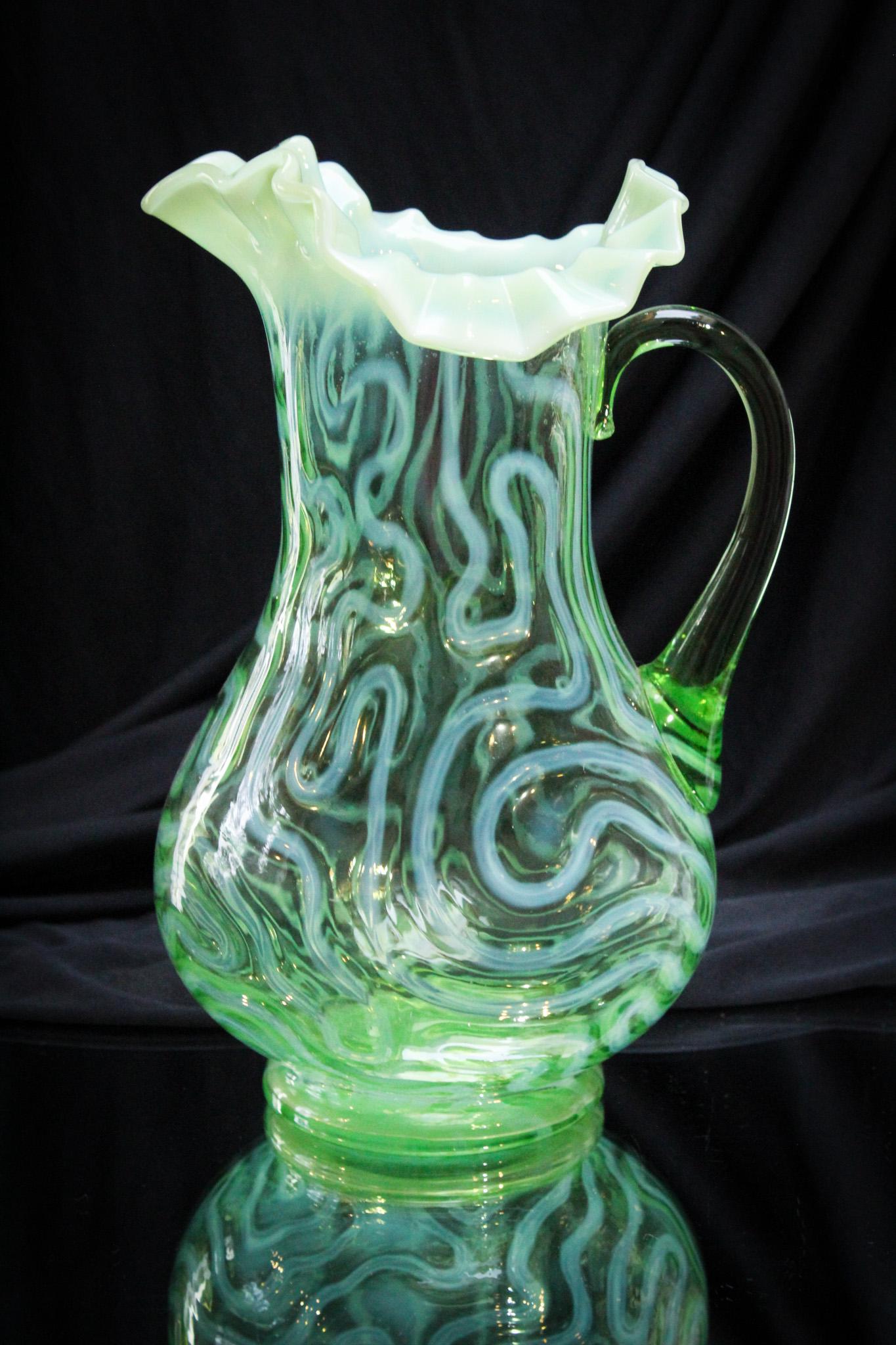 Victorian Green Opalescent Glass Swirling Maze Pitcher: Seldom do you see pieces of blown green opalescent glass. This is just one of the seldom seen pitchers and also a seldom seen pattern. Take note of this one on your bid note pad. You'll be sorry if yo